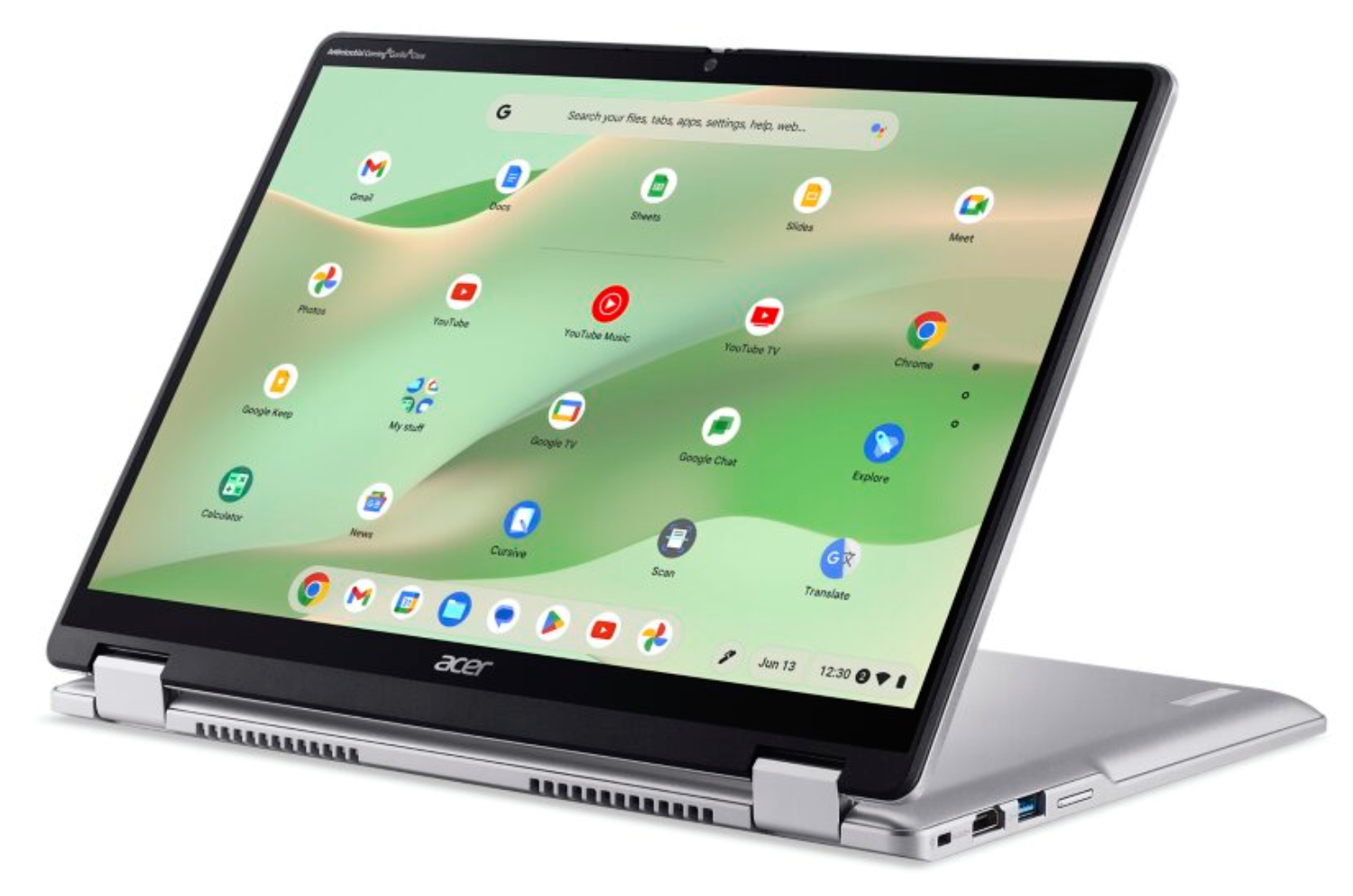 Un ordenador portátil plateado Acer Chromebook con la pantalla abierta muestra el escritorio de aplicaciones.