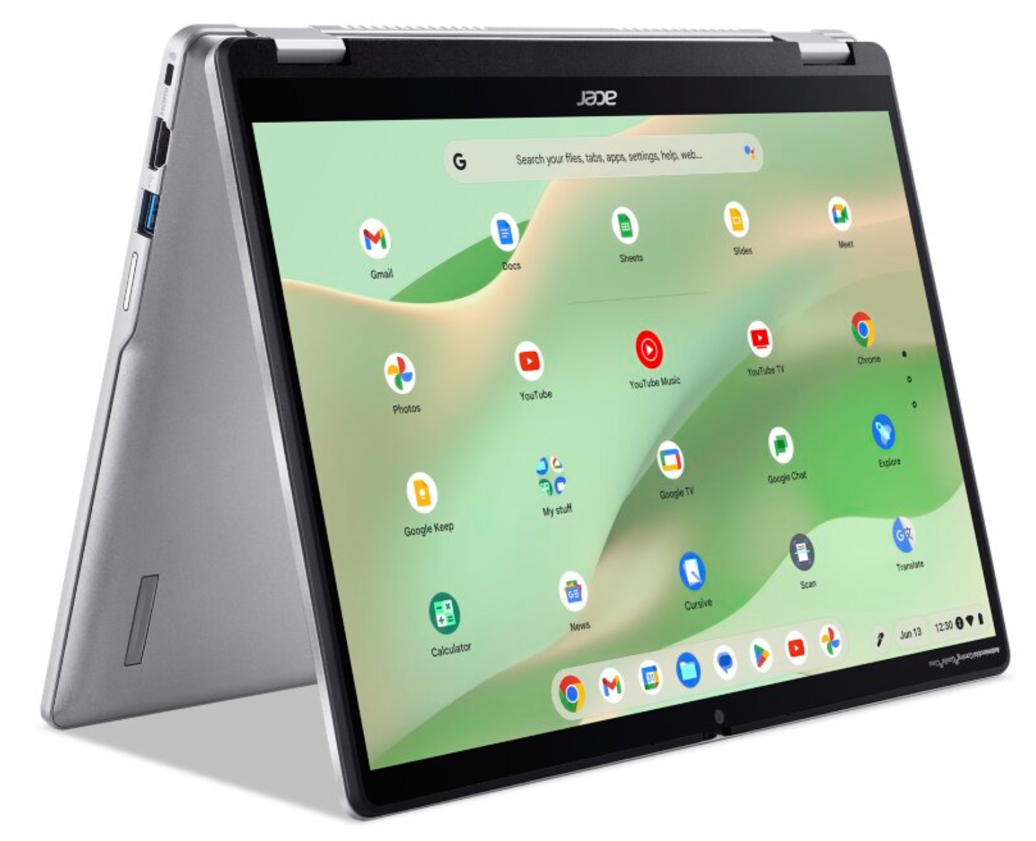 Portátil plateado en modo tienda con pantalla abierta mostrando iconos de Google ChromeOS.