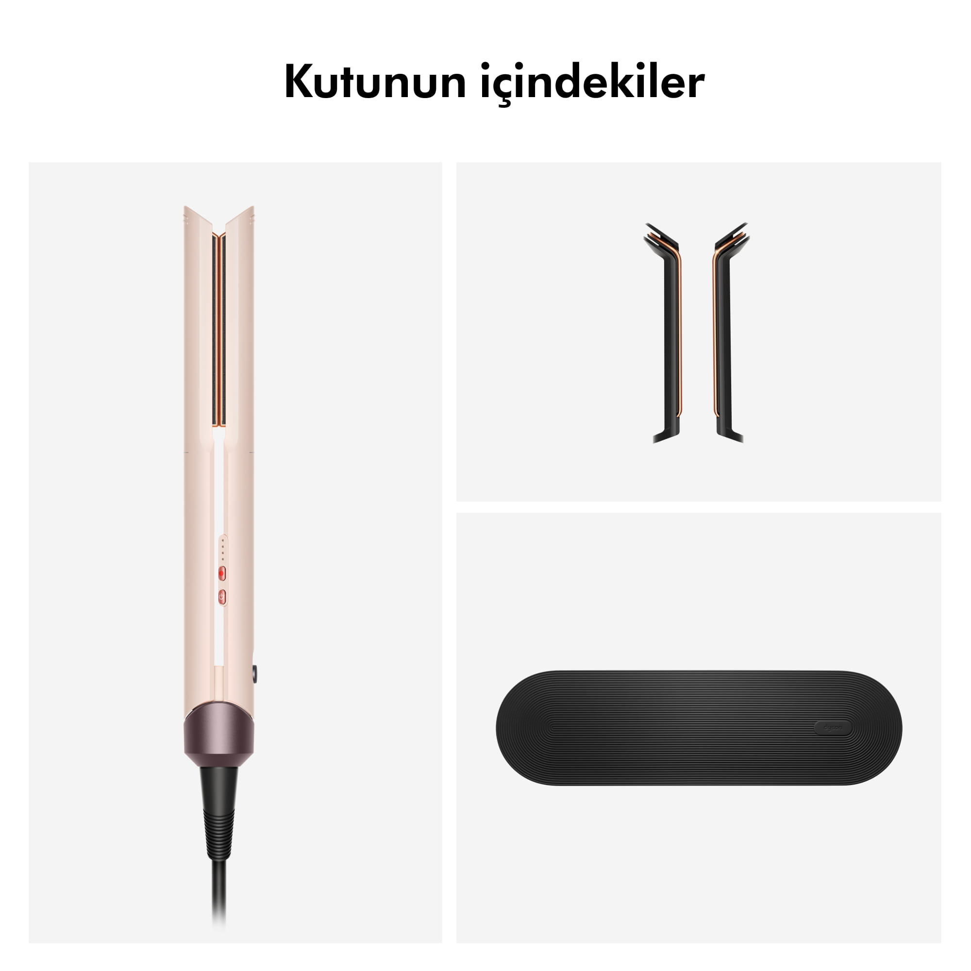 Gri arkaplan üzerinde Dyson saç düzleştirici, başlıklar ve siyah mat.