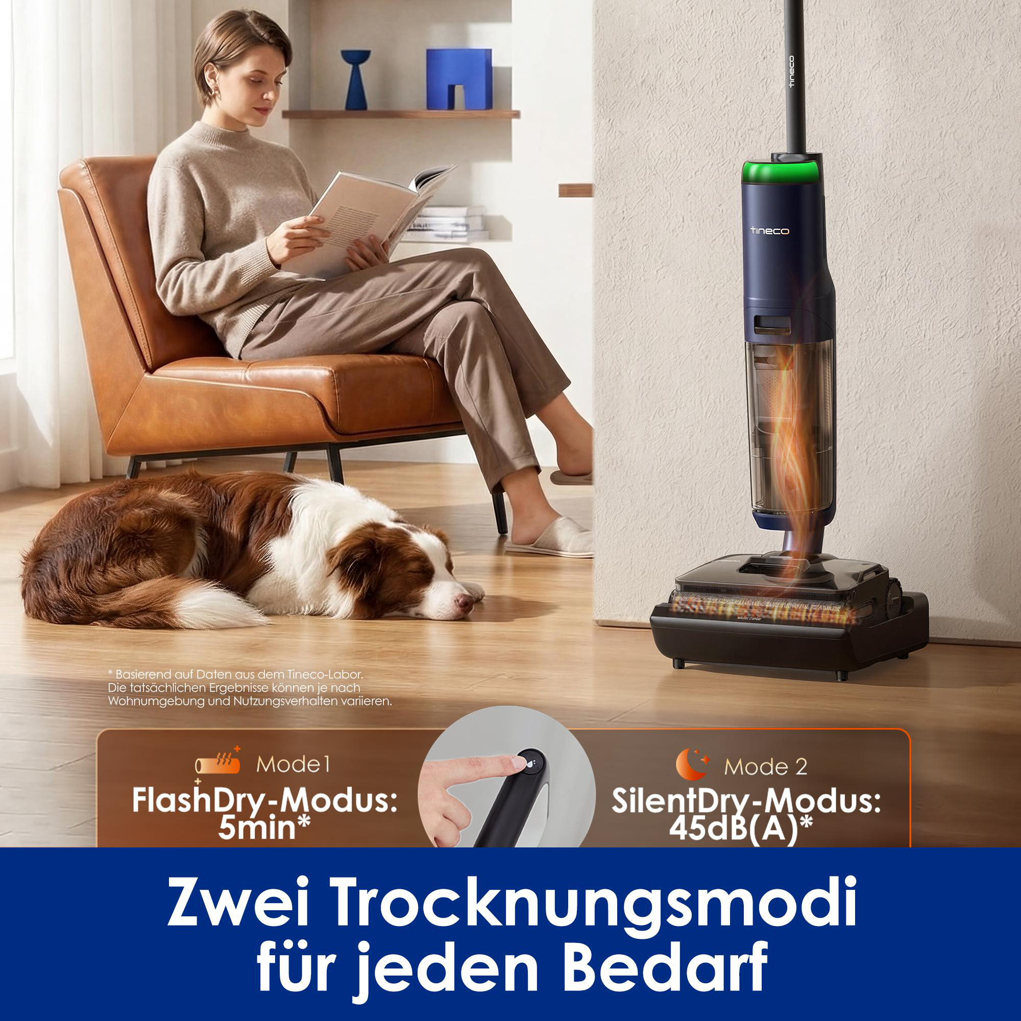 Eine Frau liest im Sessel, während ein Hund nahe einem Tineco-Staubsauger schläft.