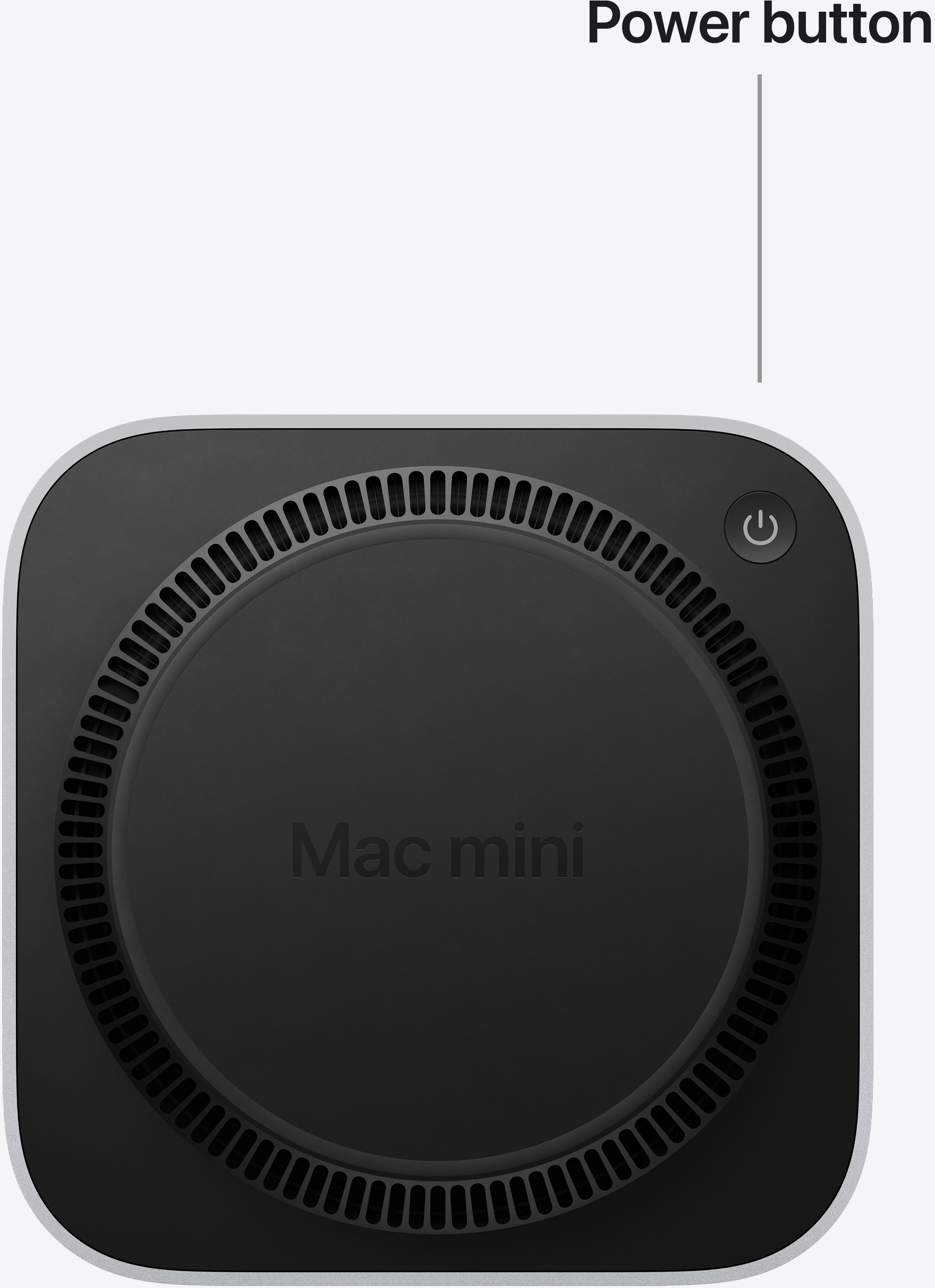 A Mac mini alja kör alakú szellőzőnyílásokkal és bekapcsológombbal.