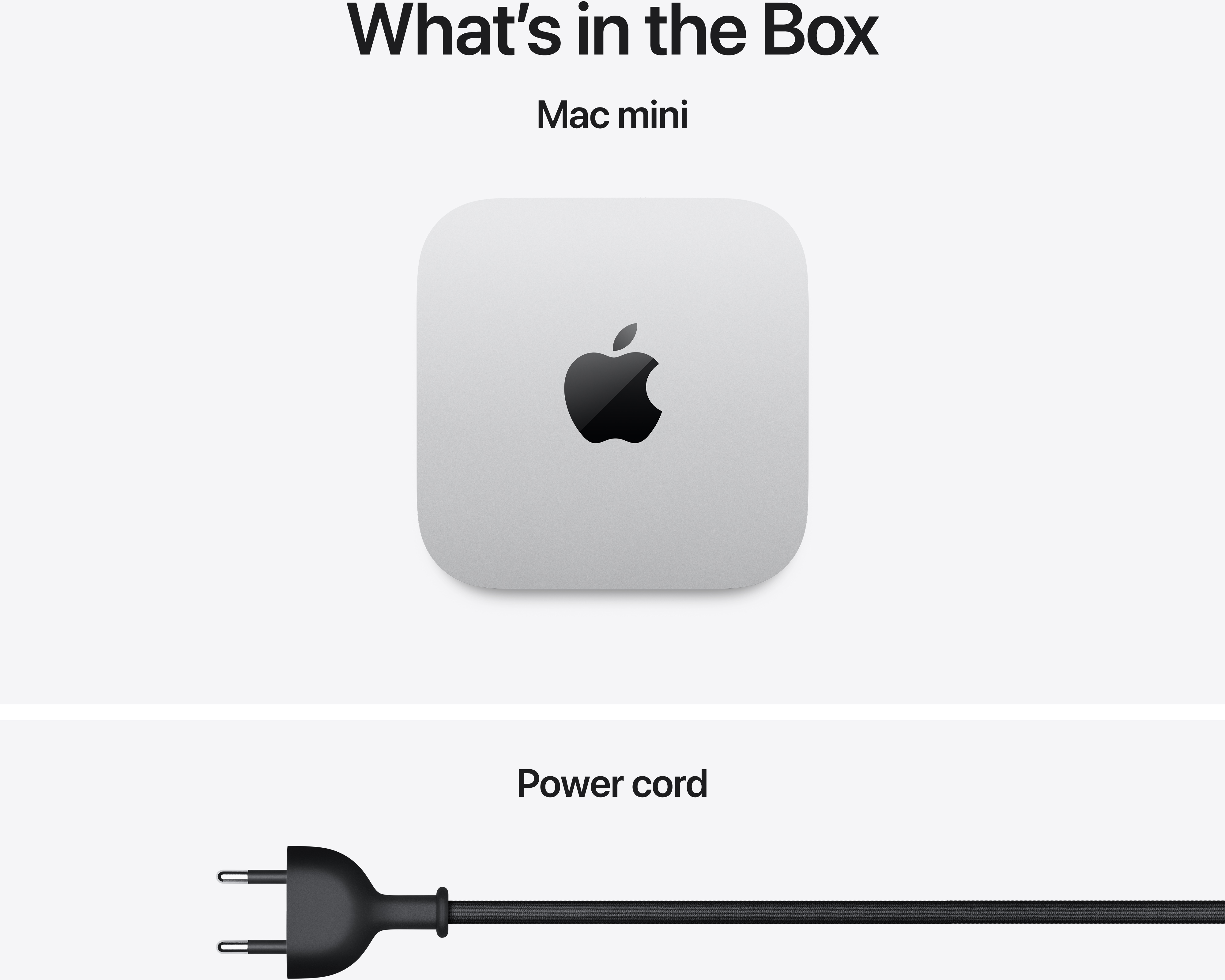 Mi van a dobozban: Mac mini és egy fekete tápkábel.