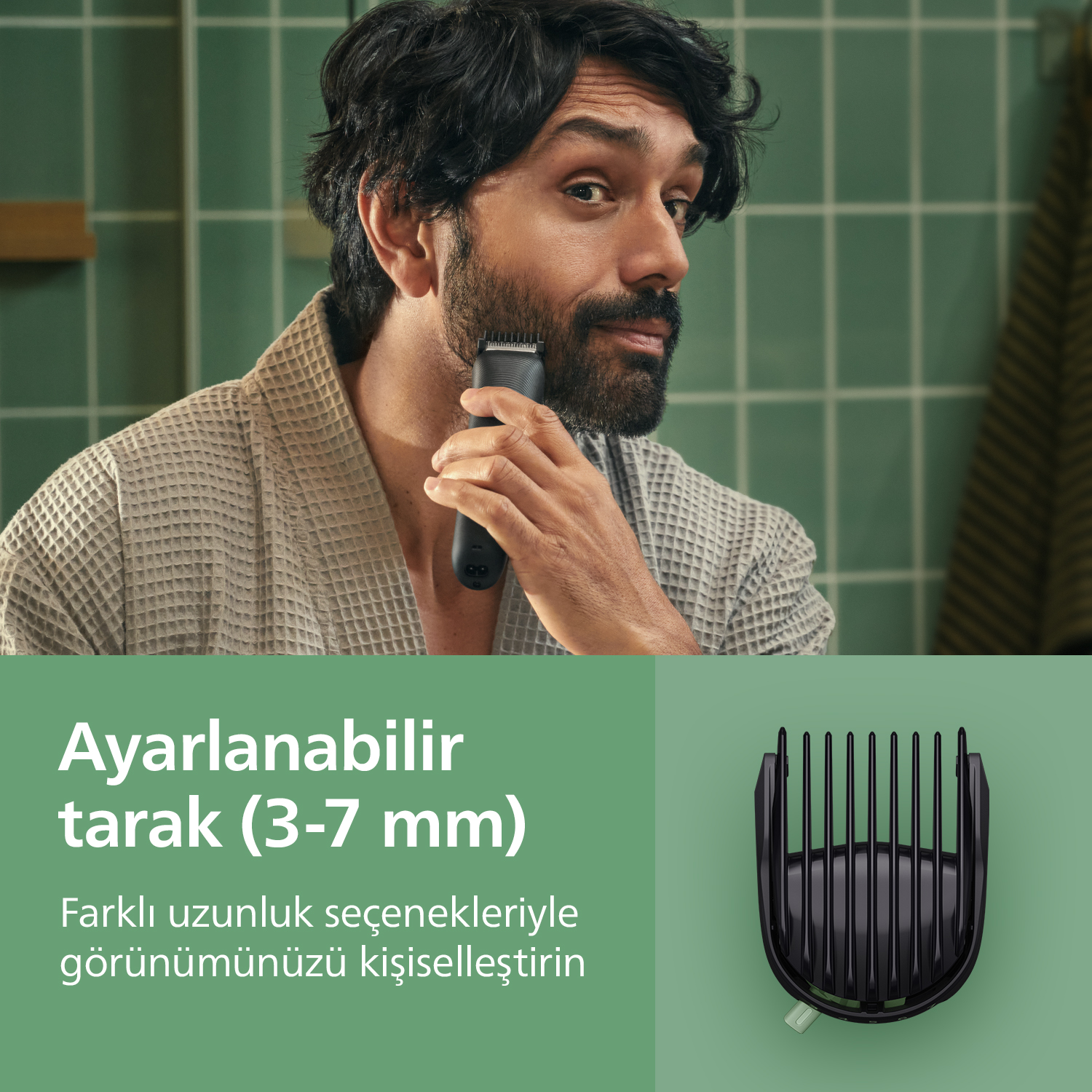 Bornozlu bir erkek siyah tıraş makinesiyle sakalını kesiyor, ayarlanabilir tarak aparatının görseliyle birlikte.