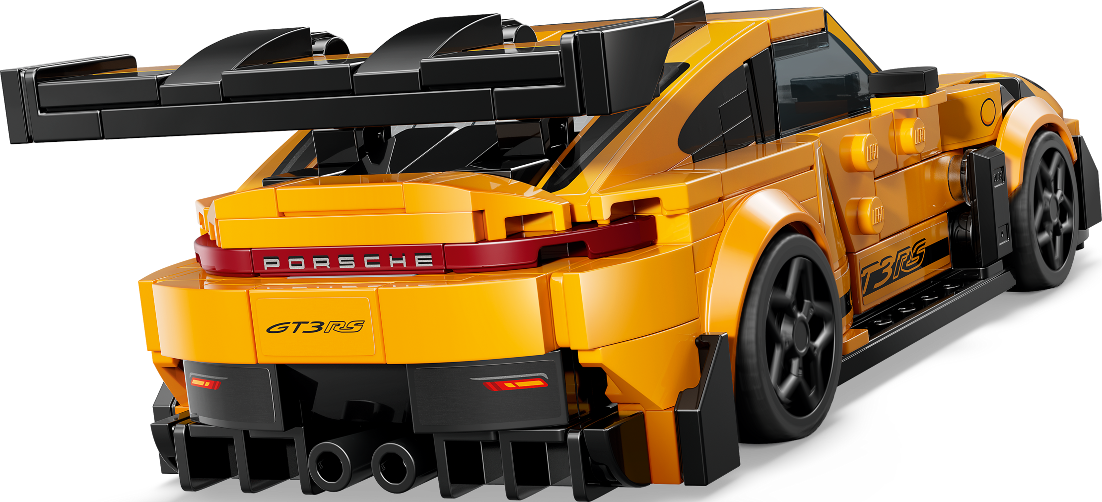 Un'auto modello Lego Porsche 911 GT3 RS gialla vista da dietro su sfondo nero.
