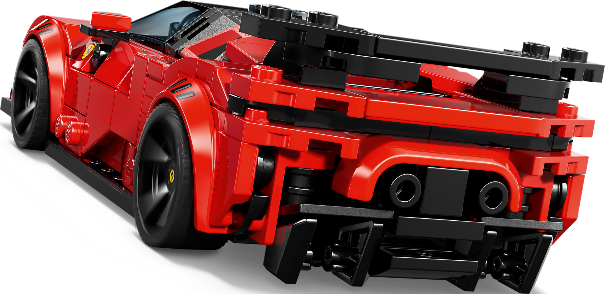 Ein rotes Lego-Spielzeugauto mit schwarzem Heckflügel auf schwarzem Hintergrund.