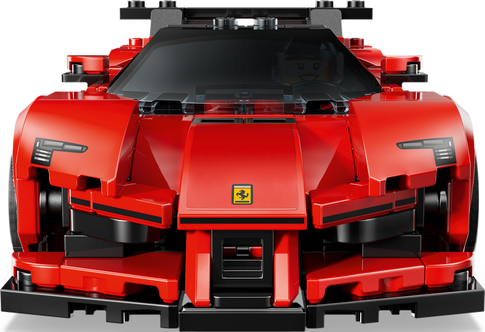 Frontansicht eines roten Lego Ferrari Rennwagens mit gelbem Markenlogo und Fahrer im Cockpit vor schwarzem Hintergrund.