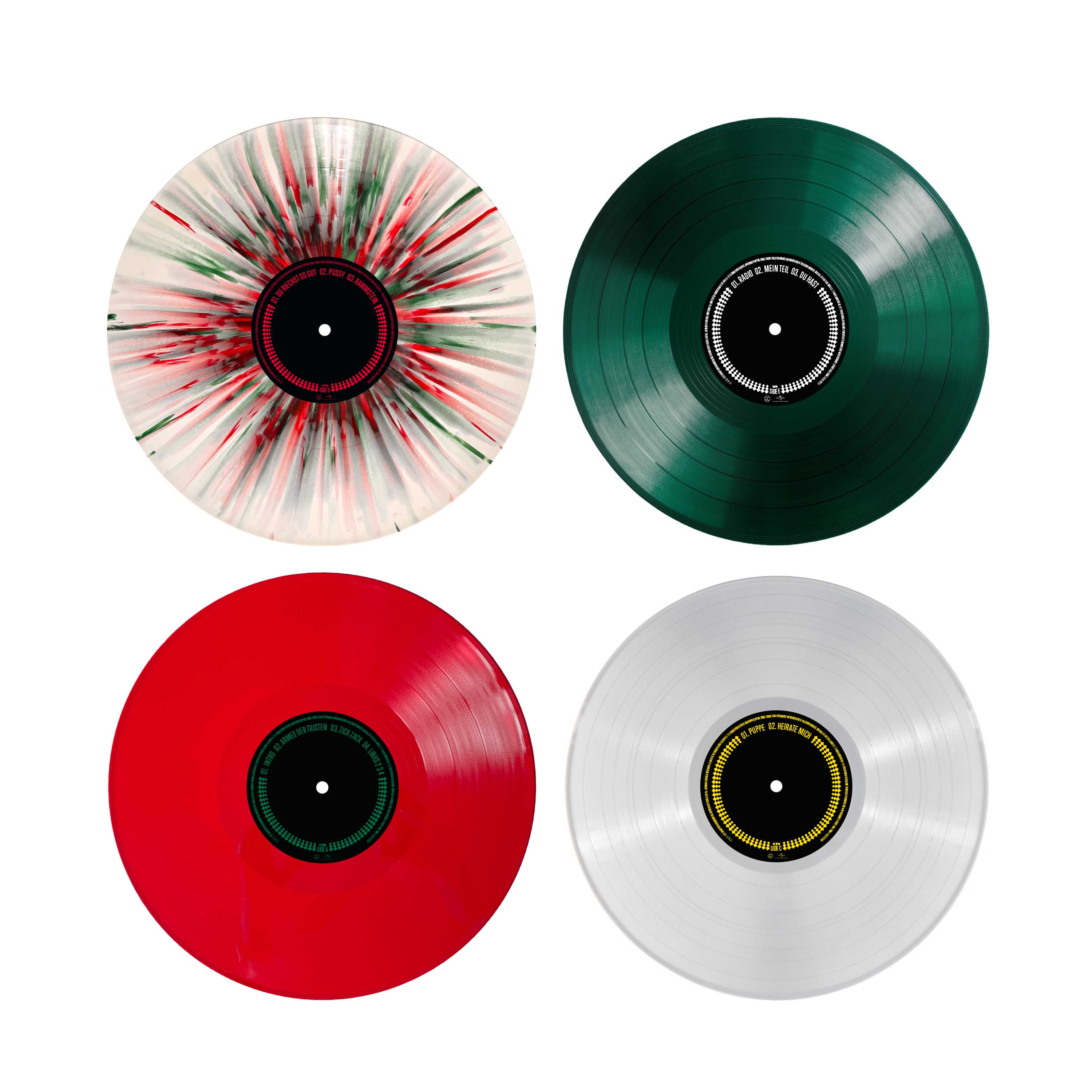 Vier farbige Vinyl-Schallplatten: eine spritzerverzierte, eine grüne, eine rote und eine weiße mit schwarzen Labels.