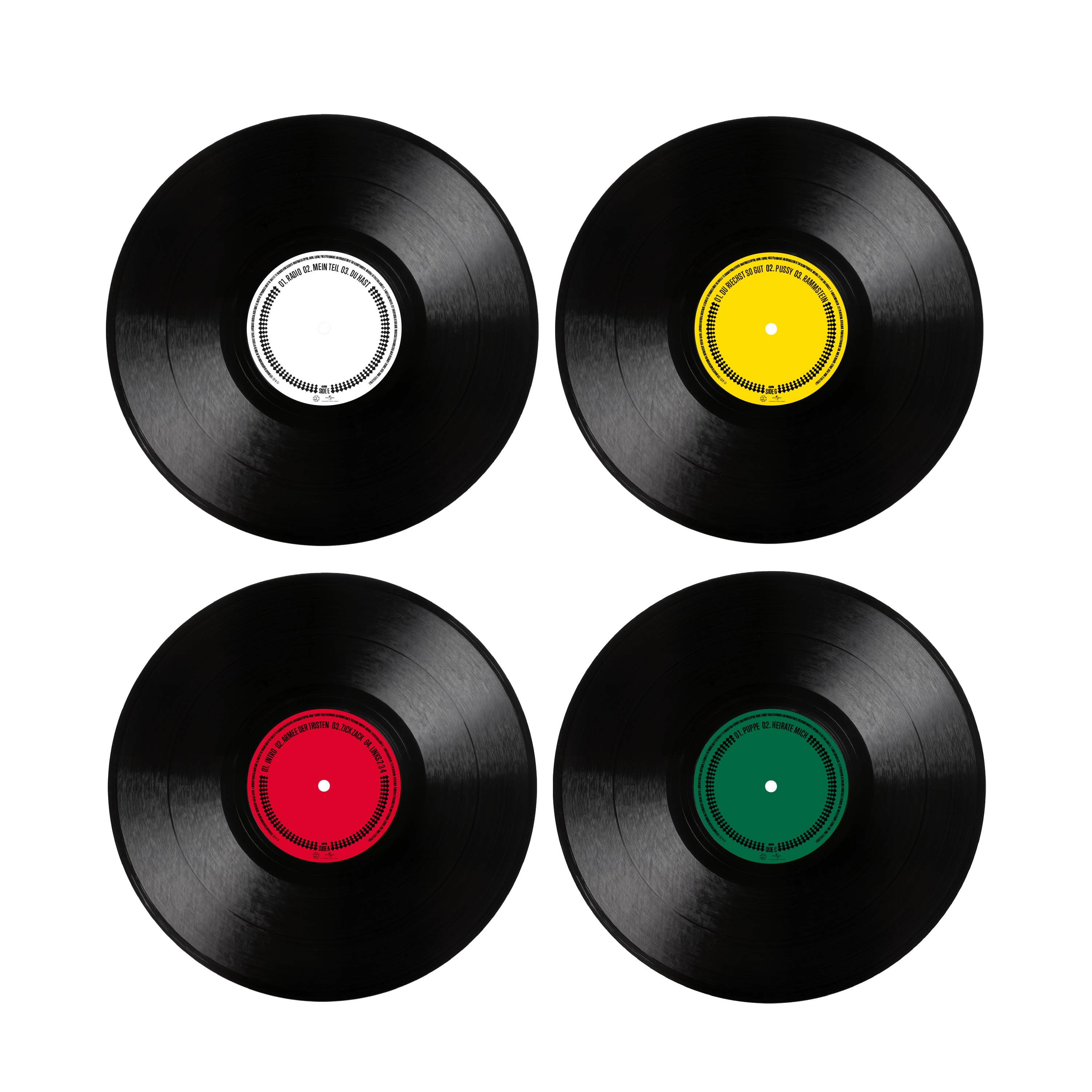 Vier schwarze Schallplatten mit weißen, gelben, roten und grünen Labels auf weißem Hintergrund.