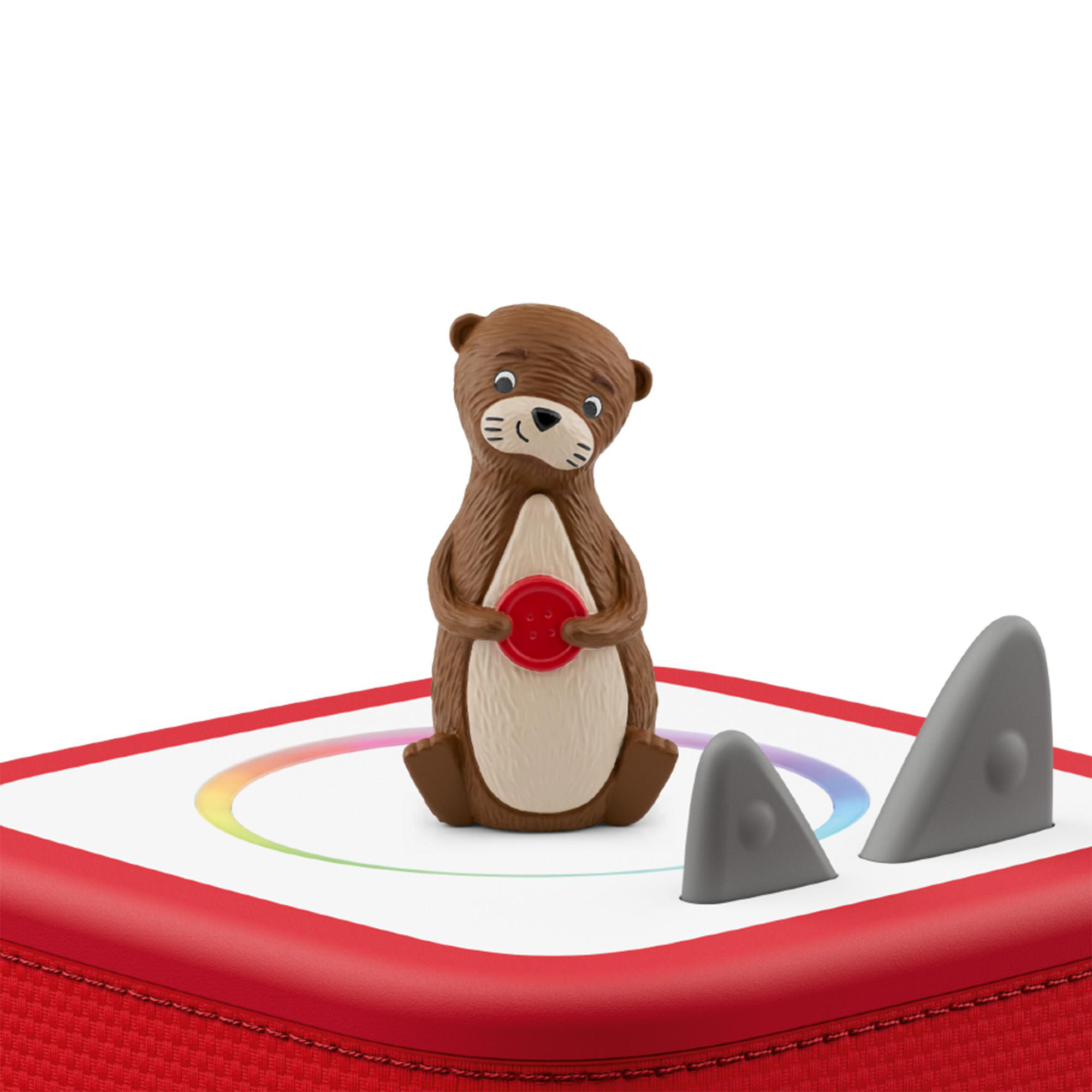 Eine braune Otterfigur mit einem roten Knopf steht auf einer weißen Platte mit rotem Rand.