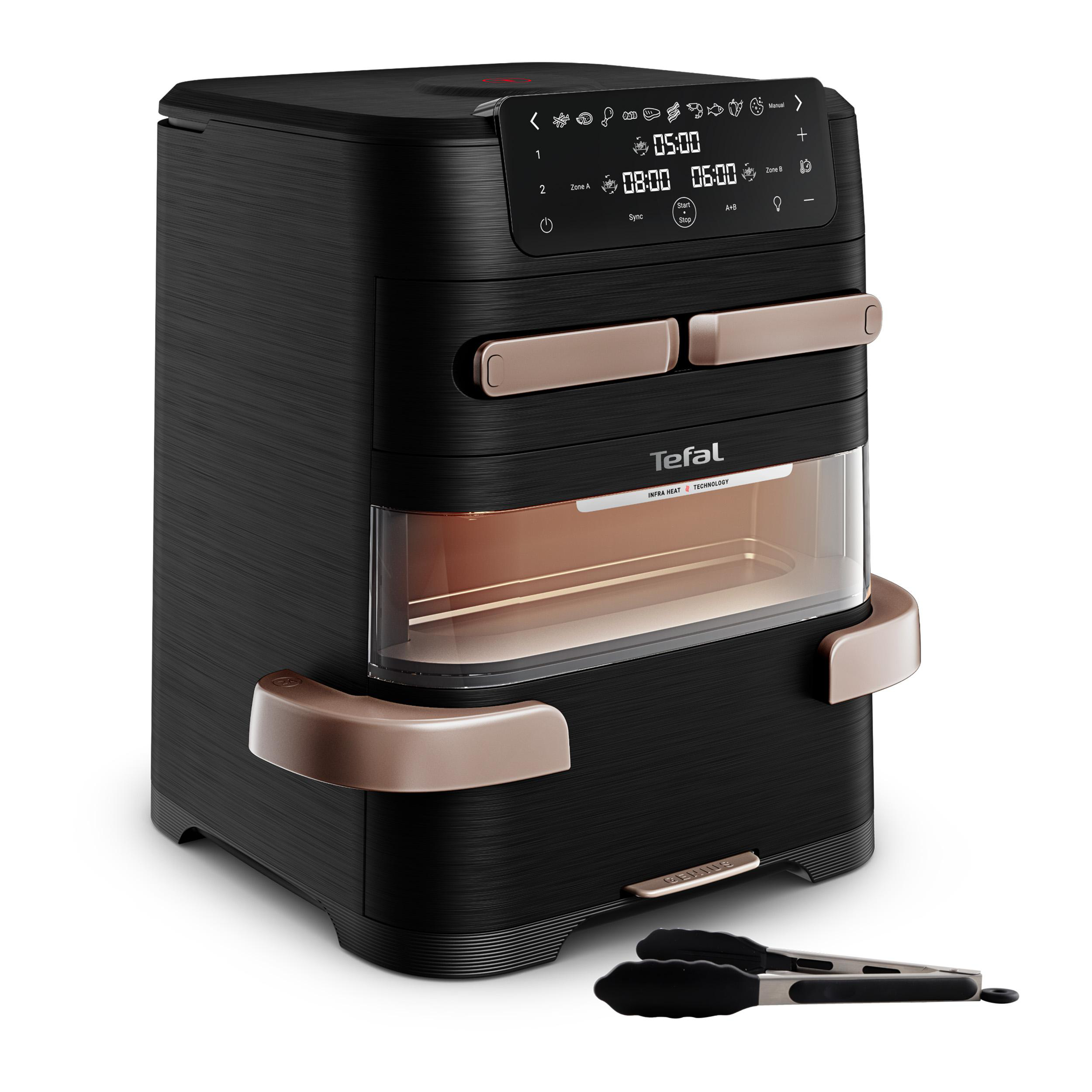 Schwarze Tefal Heißluftfritteuse mit digitalem Display, Kupferelementen, Sichtfenster und Zange.