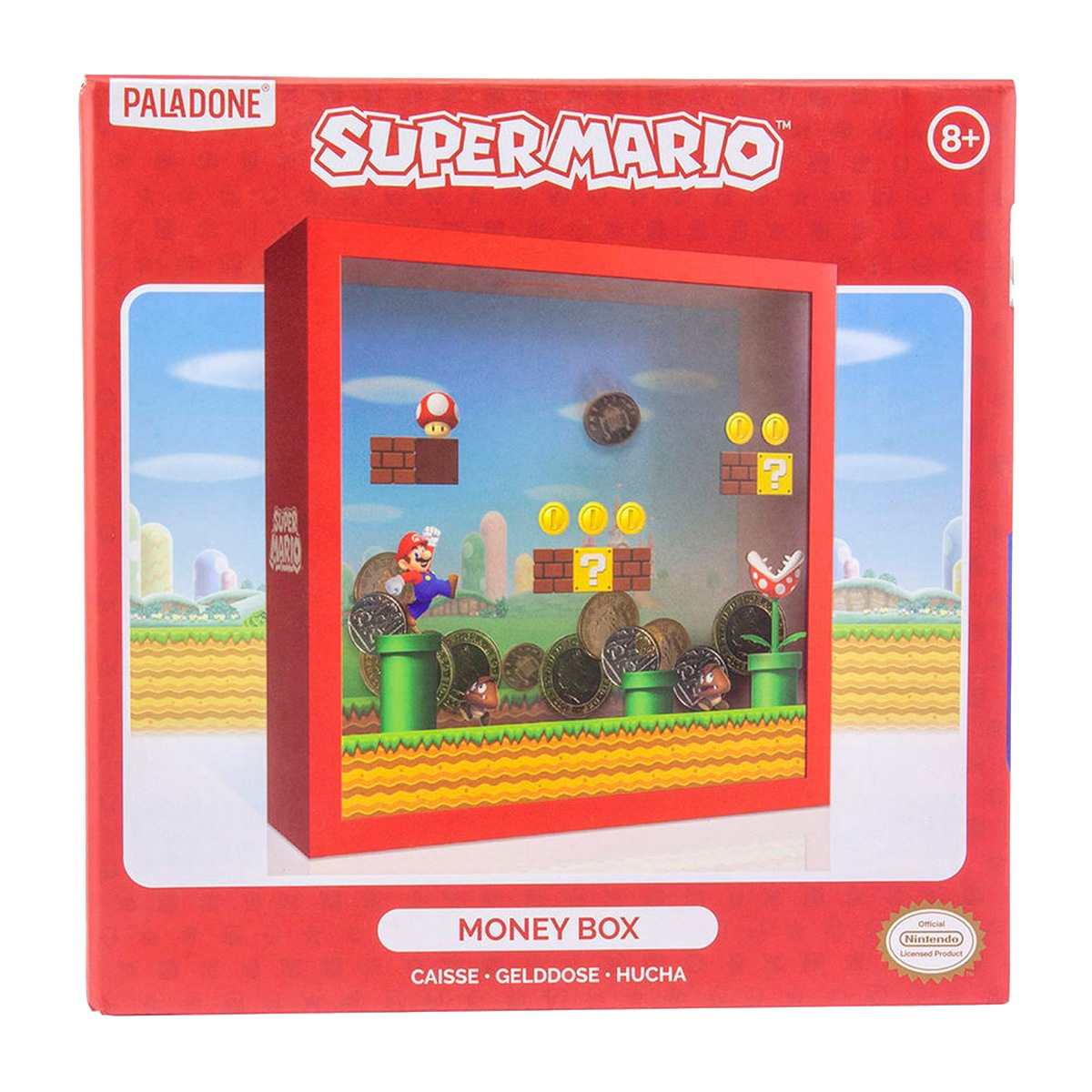 Un embalaje de hucha de Super Mario en rojo, mostrando una escena de juego con Mario, monedas, tuberías y ladrillos.