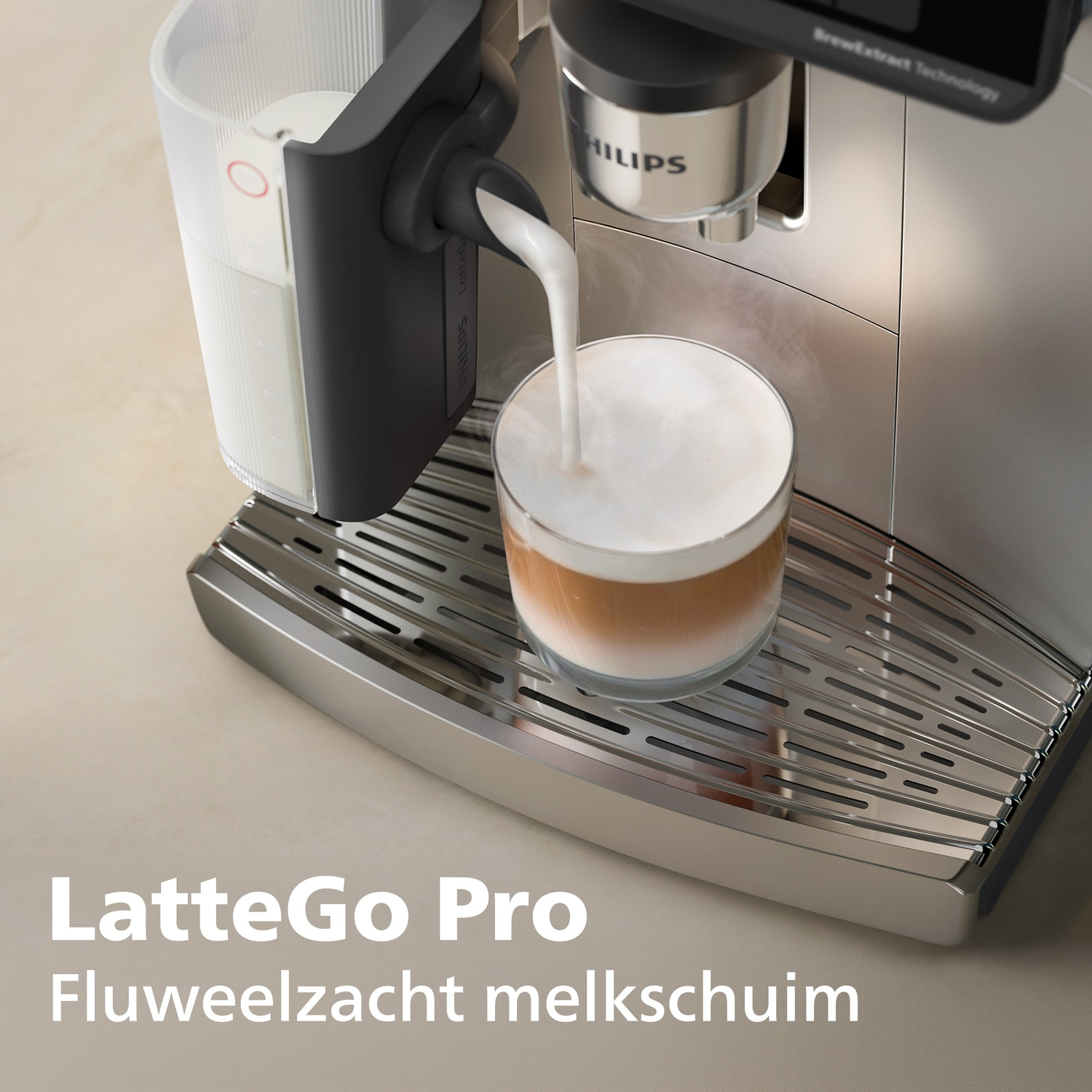 A coffee machine pours milk into a glass of coffee on a stainless steel drip tray.