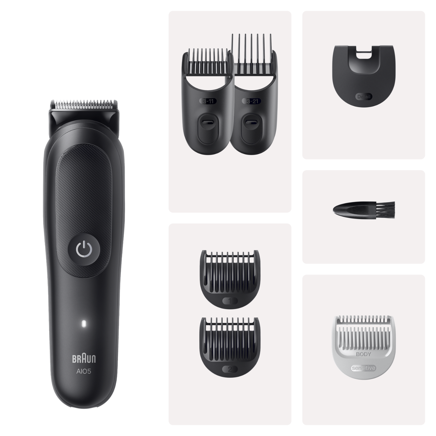 Una recortadora de pelo Braun negra con varios peines y accesorios sobre fondo claro.