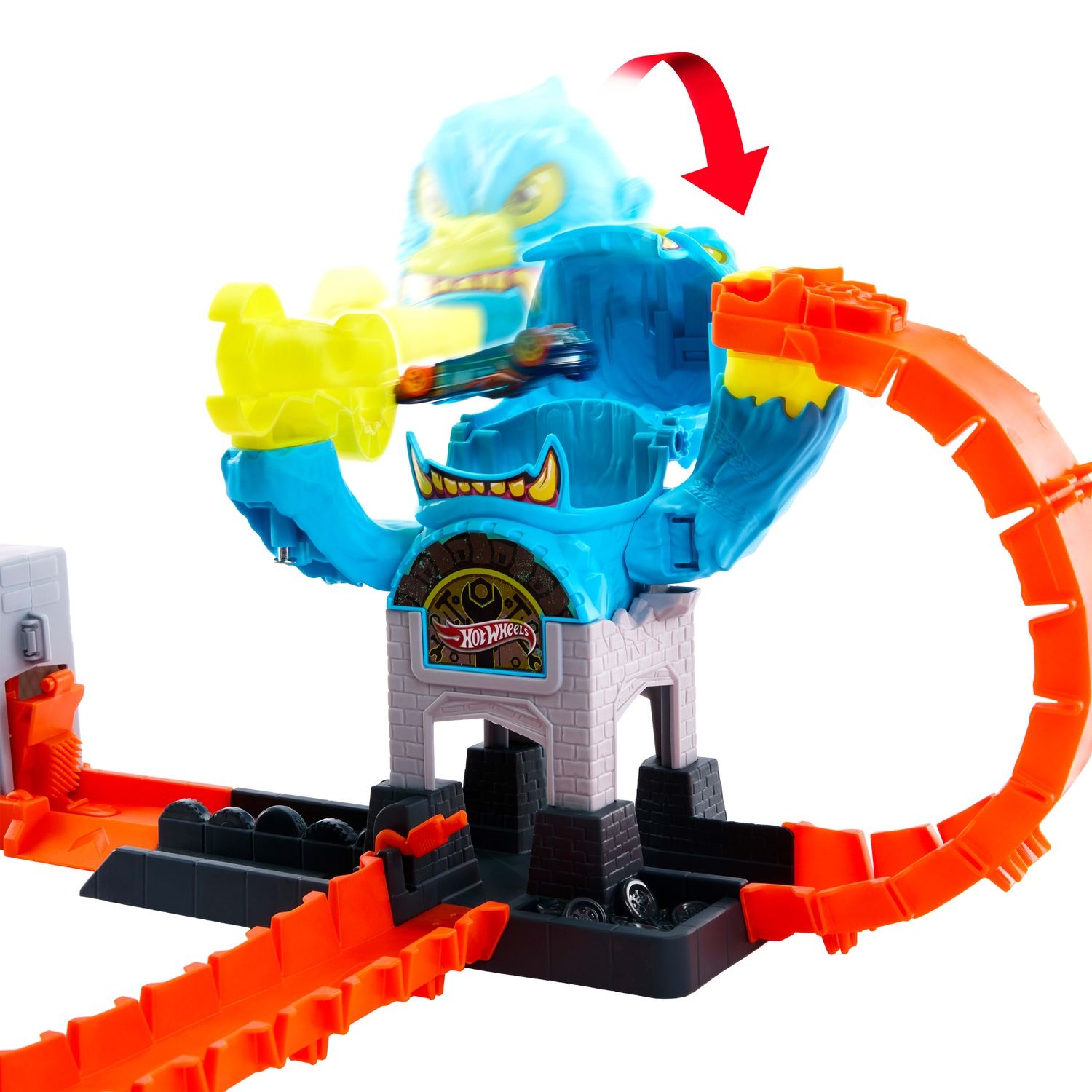 A blue Hot Wheels monster playset with an orange track, showing a toy car launching through the air.