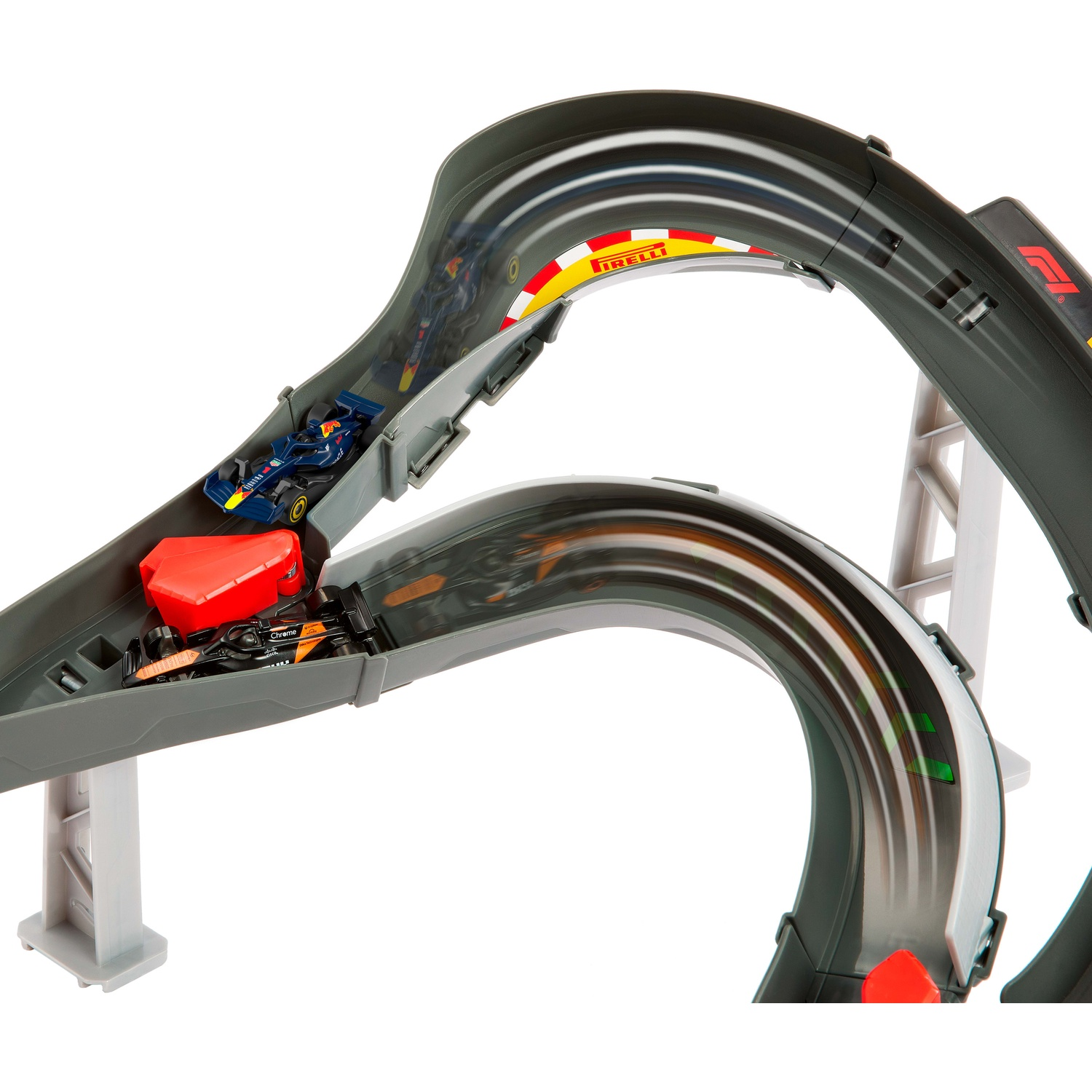 Two toy Formula 1 cars race down a grey, curved racetrack featuring red accents.