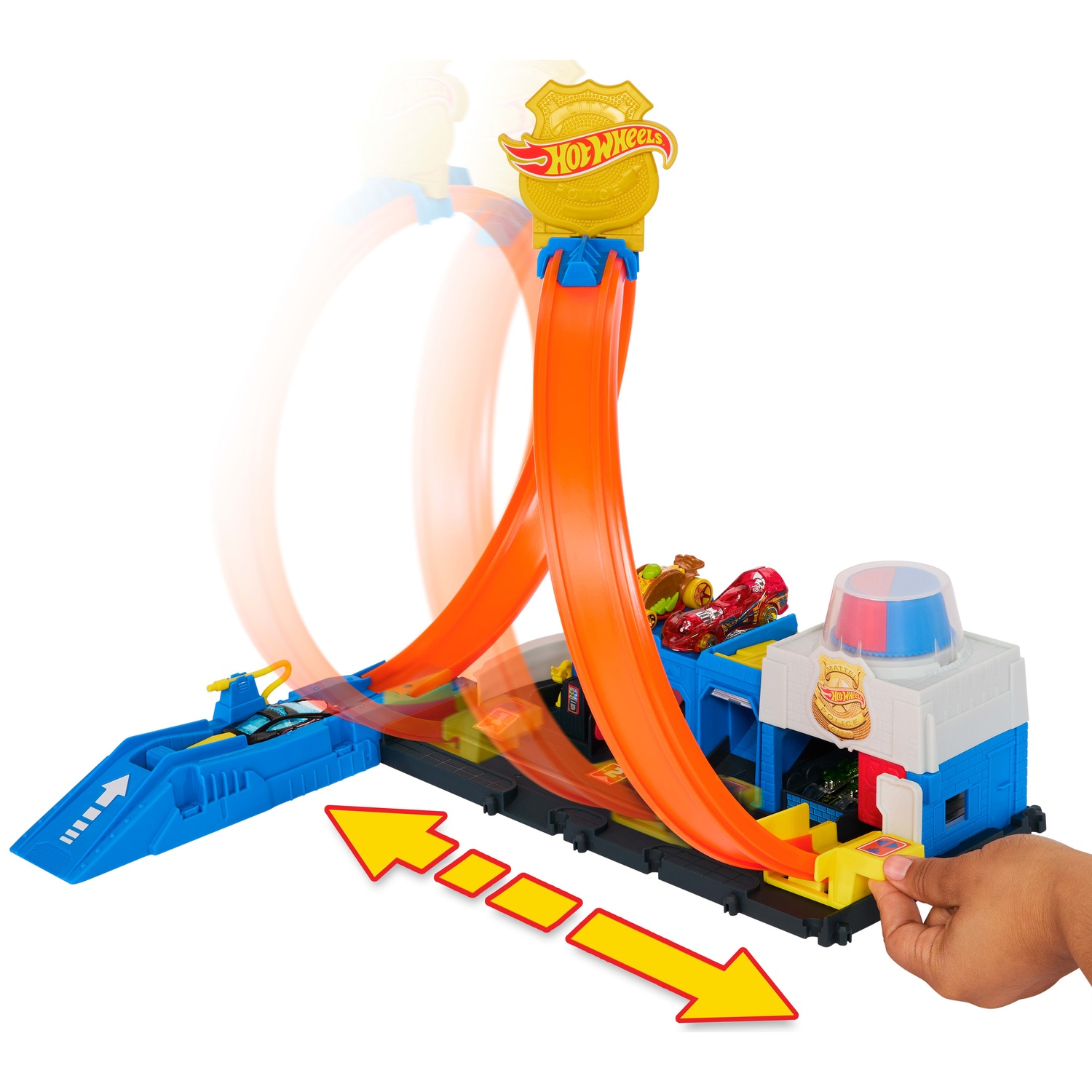 Hot Wheels police station toy set with a hand sliding an orange loop track.