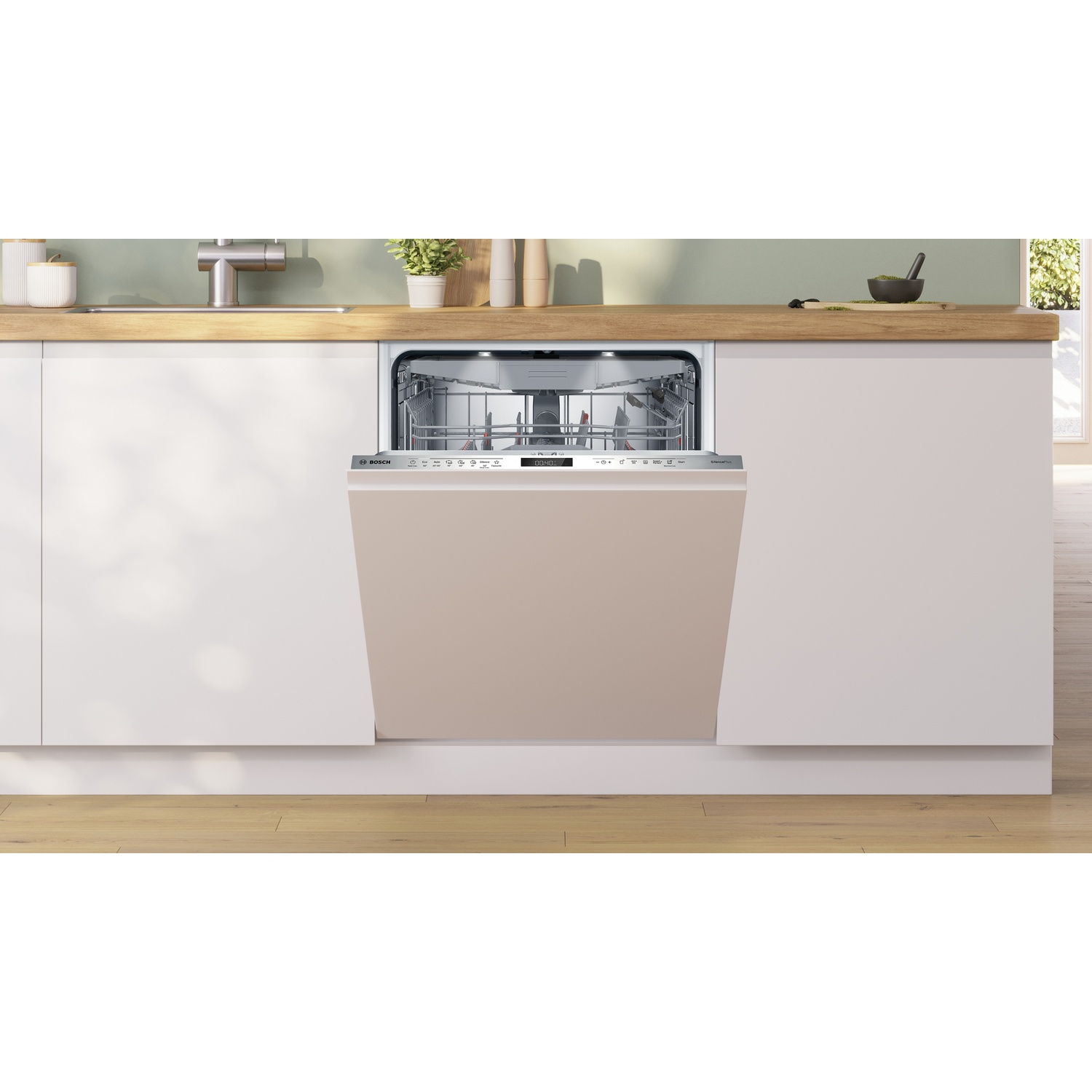 Un lave-vaisselle encastrable beige semi-ouvert est placé dans un comptoir blanc en bois.