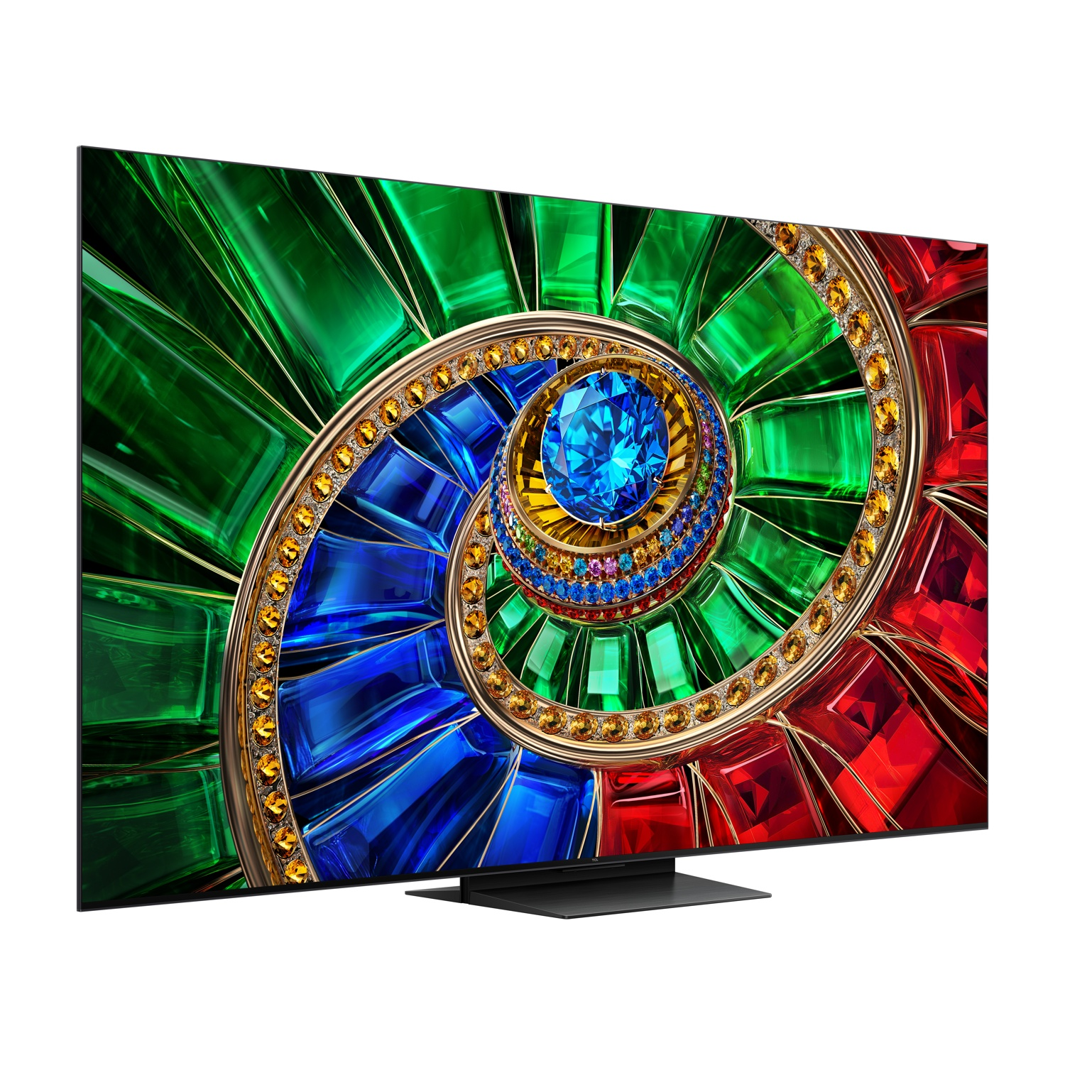 Una TV a schermo piatto mostra un motivo a spirale colorato di cristalli verdi, rossi, blu e oro.