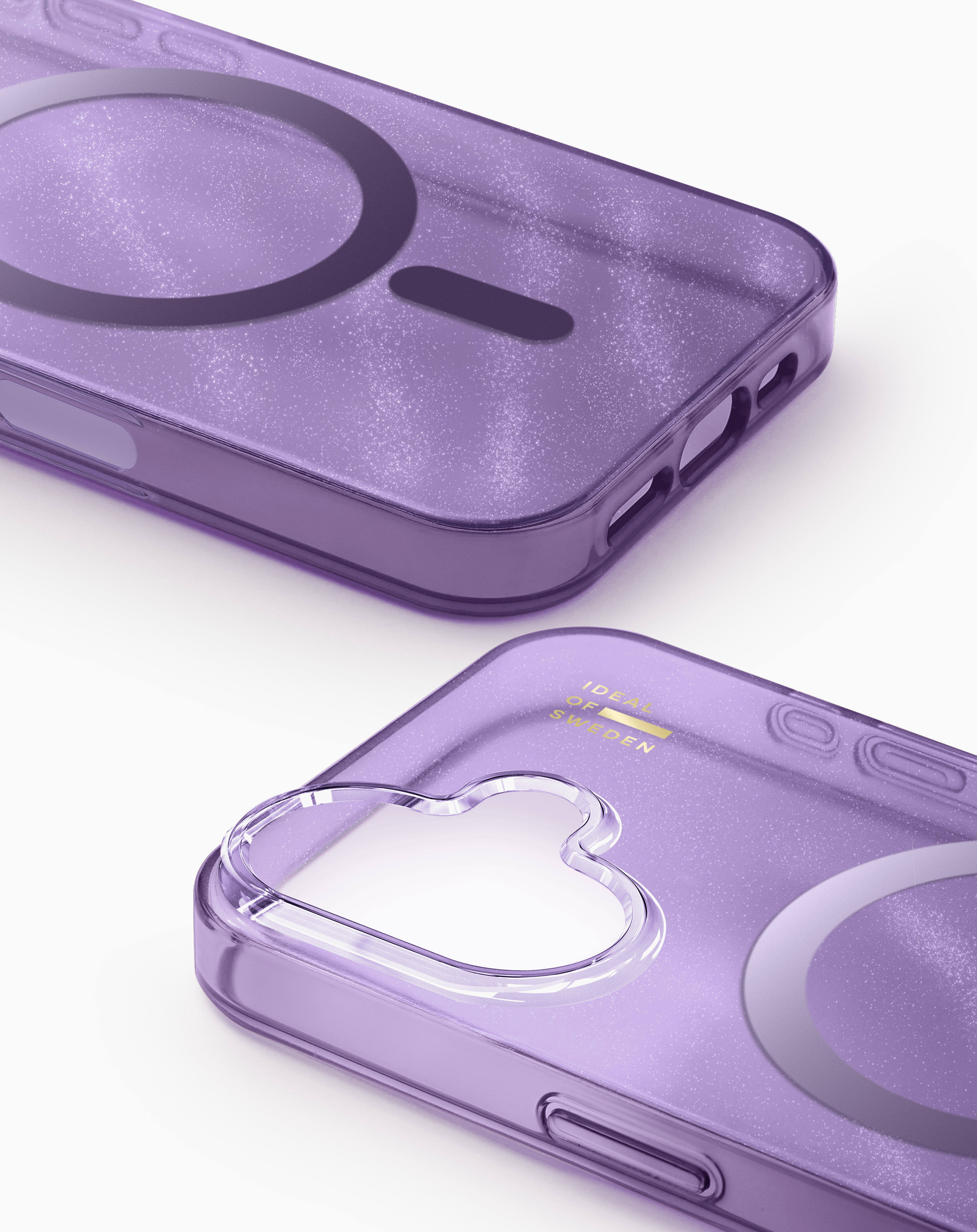 Zwei glitzernde, violette Handyhüllen mit MagSafe-Kreis und wolkenförmigem Kameraausschnitt auf weißem Grund.