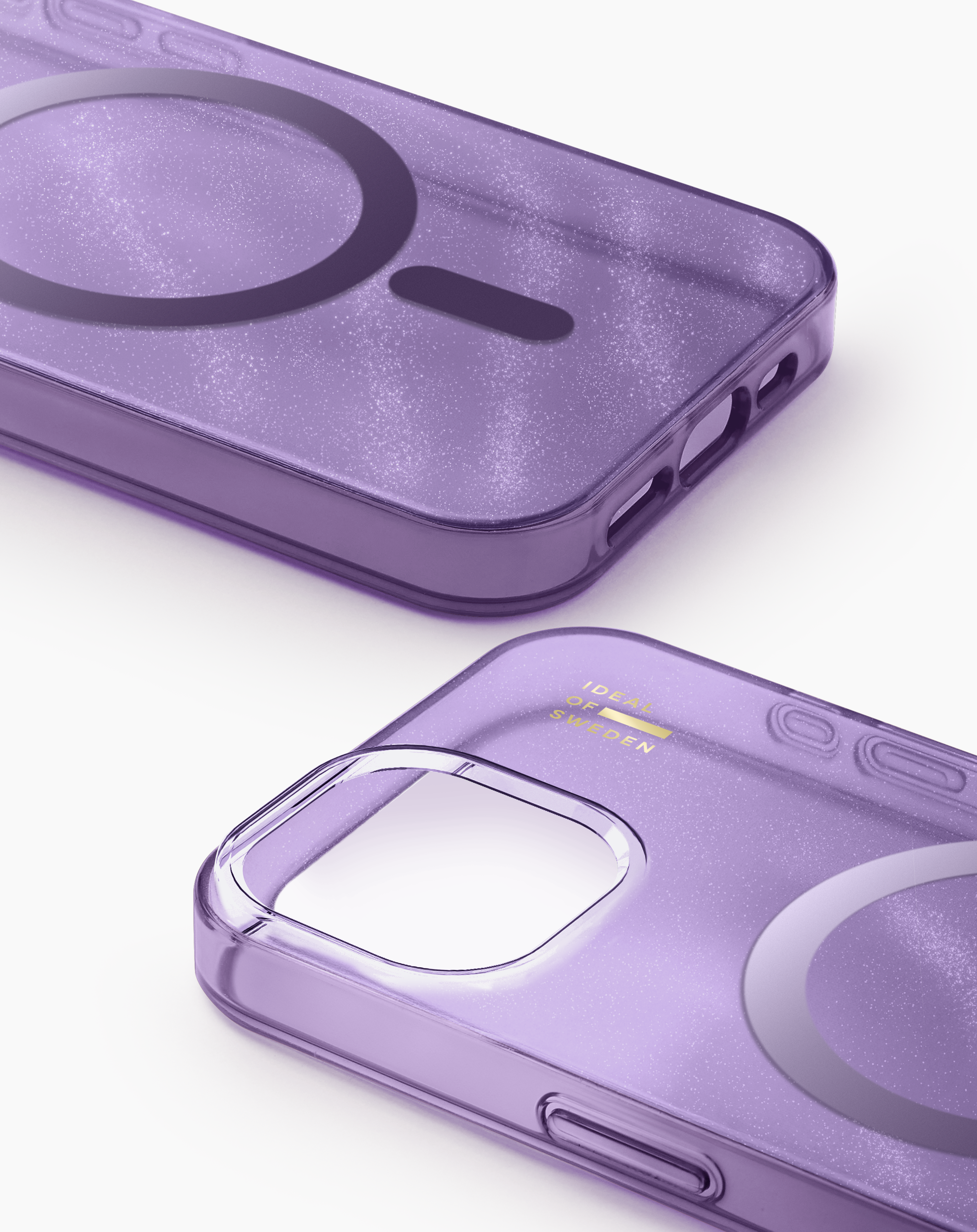 Zwei glitzernde, violette Handyhüllen mit MagSafe-Kreis auf weißem Hintergrund.