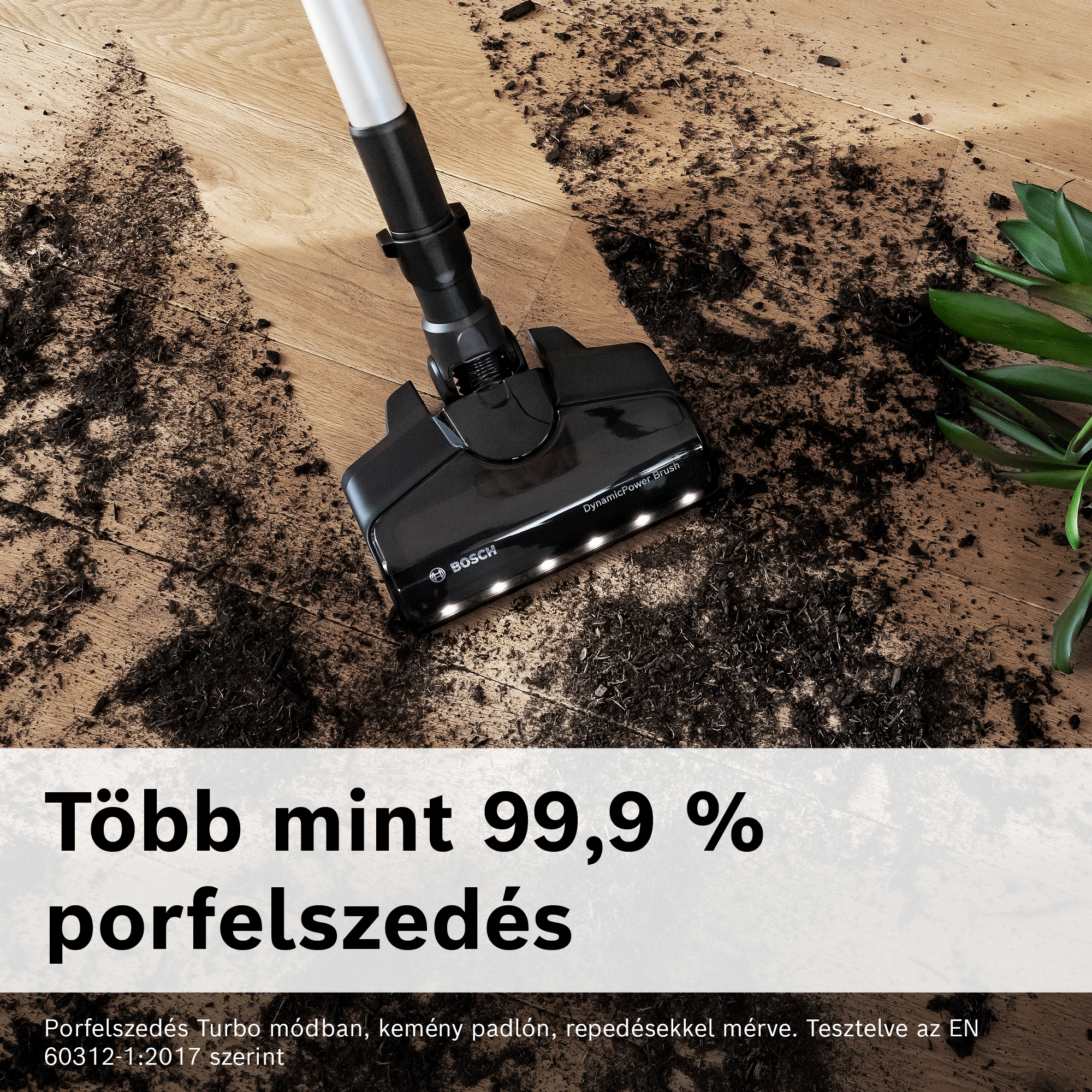 Egy Bosch porszívó tisztítja a piszkot és a földet a fa padlóról.