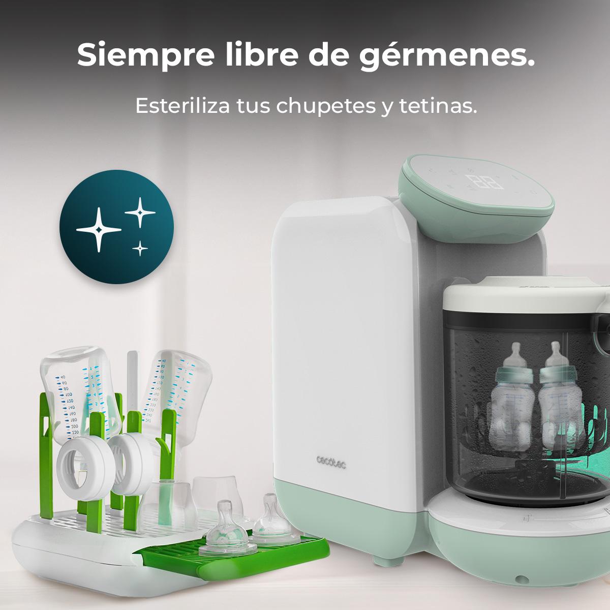 Esterilizador de biberones blanco y verde menta junto a un escurridor con biberones y chupetes en una superficie blanca.
