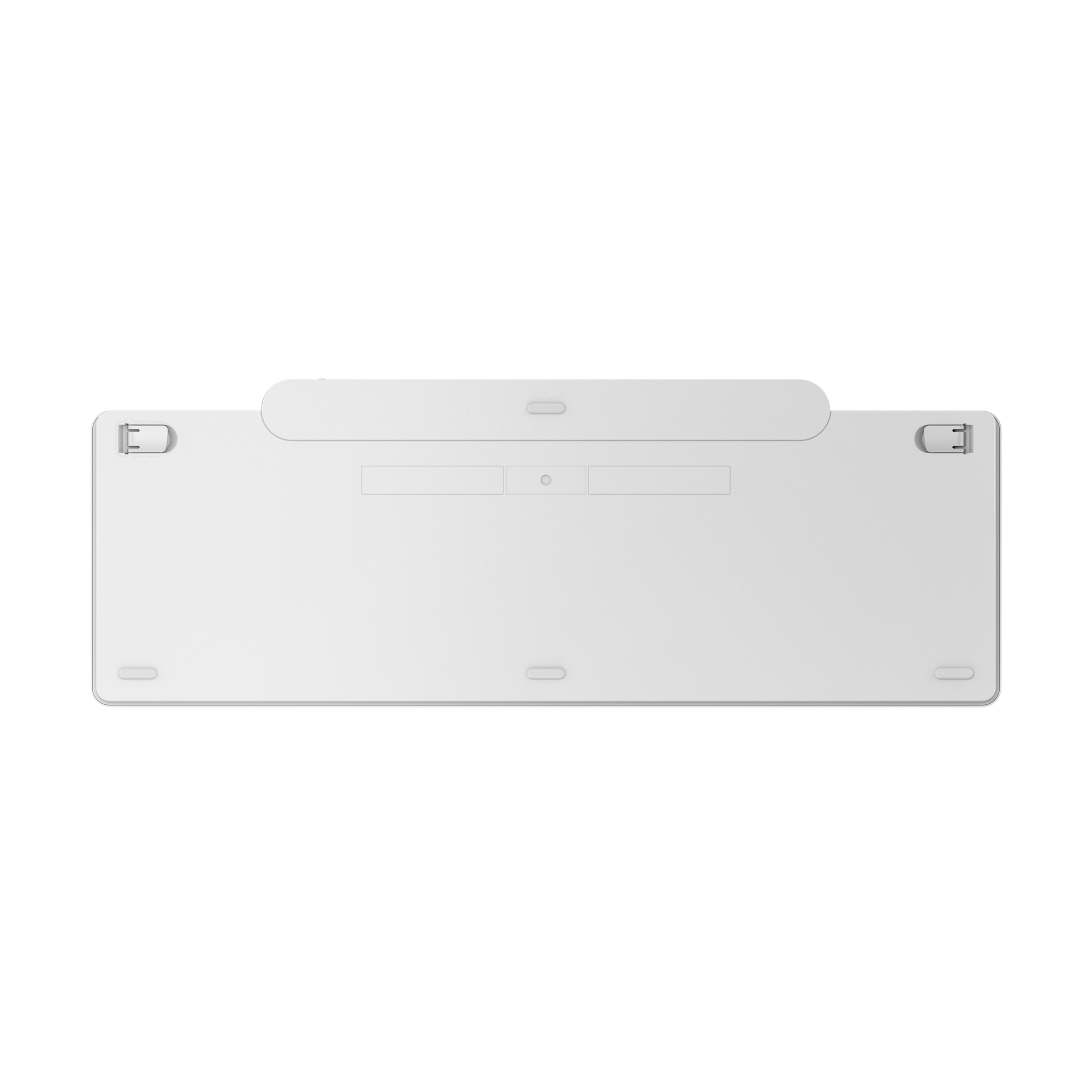 La parte inferior blanca de un teclado minimalista con patas plegables y almohadillas de goma sobre fondo negro.