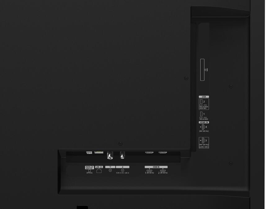 Tył czarnego telewizora z widocznymi etykietowanymi portami wejściowymi dla HDMI, USB i LAN.