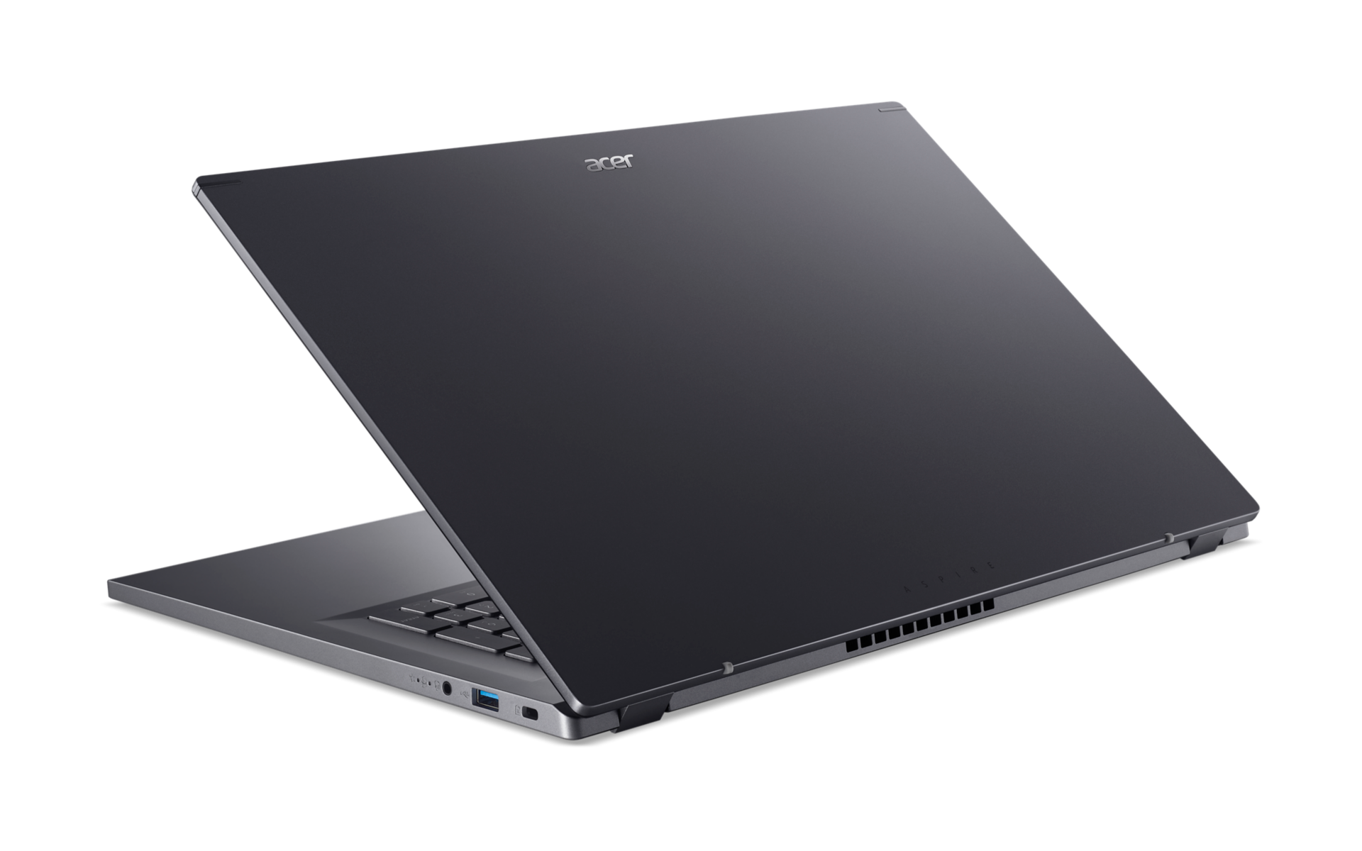 Ein geschlossener grauer Acer Aspire Laptop vor schwarzem Hintergrund.