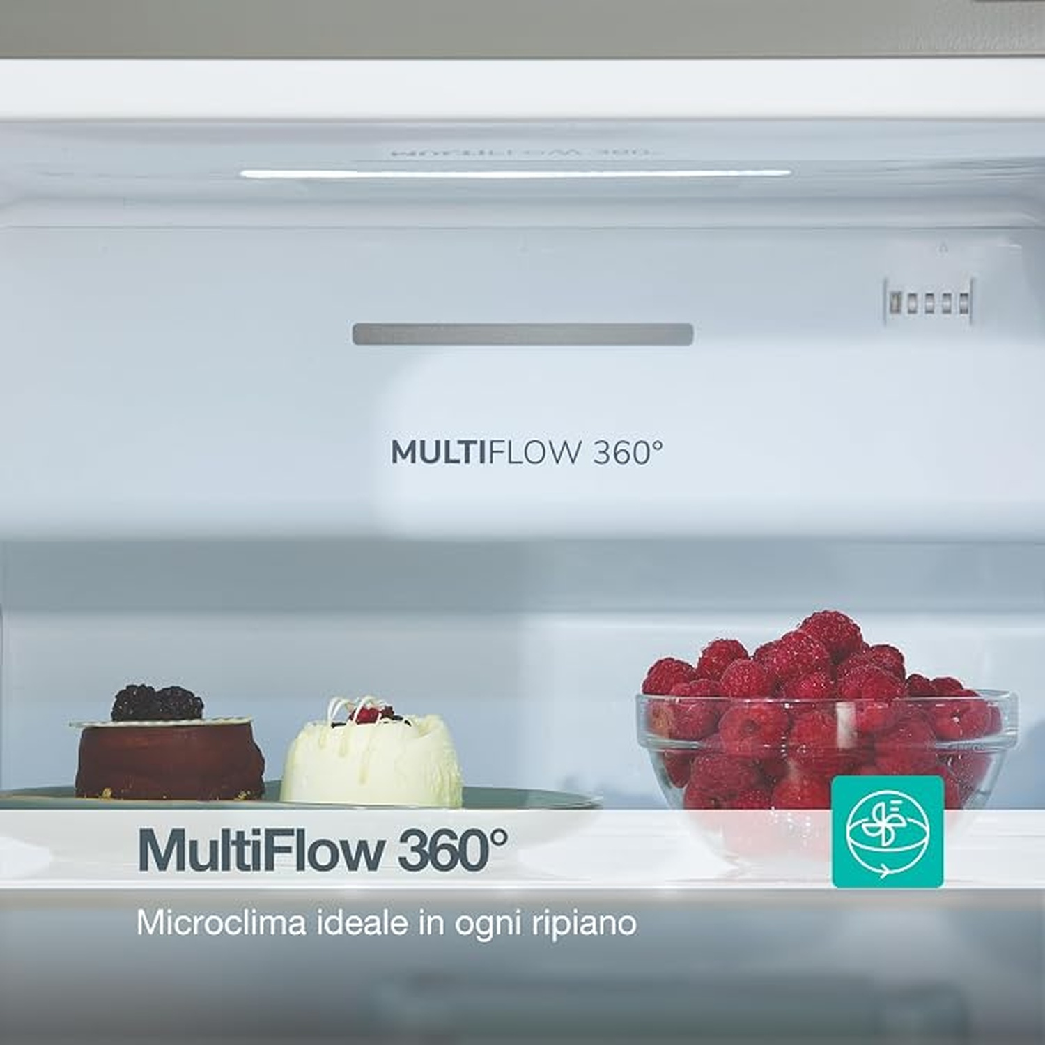 Interno del frigorifero con logo Multiflow 360, dolci e ciotola di lamponi.