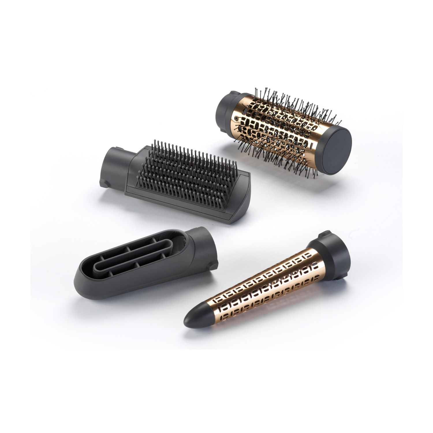 Quattro diversi accessori per lo styling dei capelli in nero e oro rosa su superficie bianca.