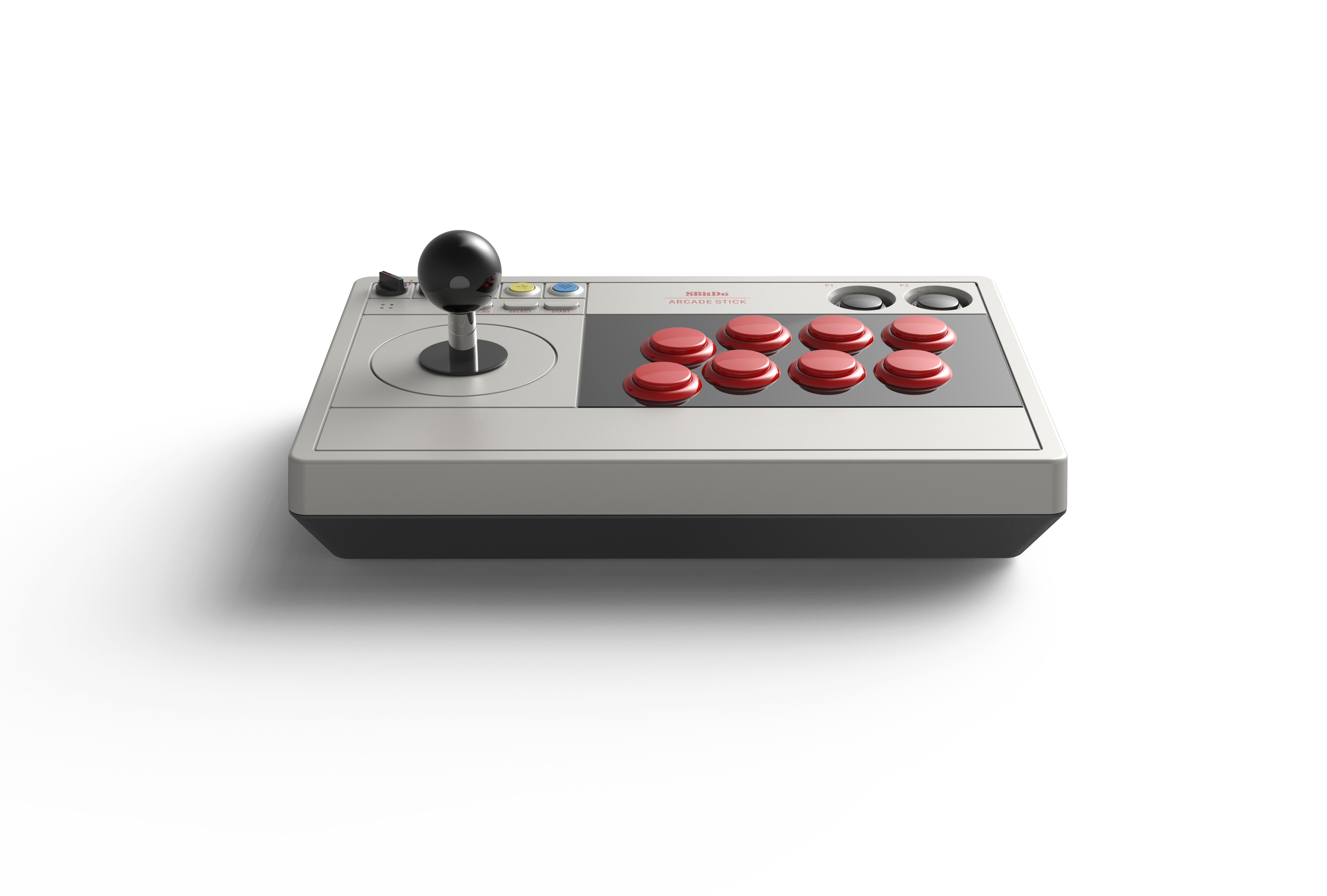 Beyaz arkaplanda siyah joystick ve sekiz kırmızı aksiyon düğmesine sahip gri retro arcade kontrolcüsü.