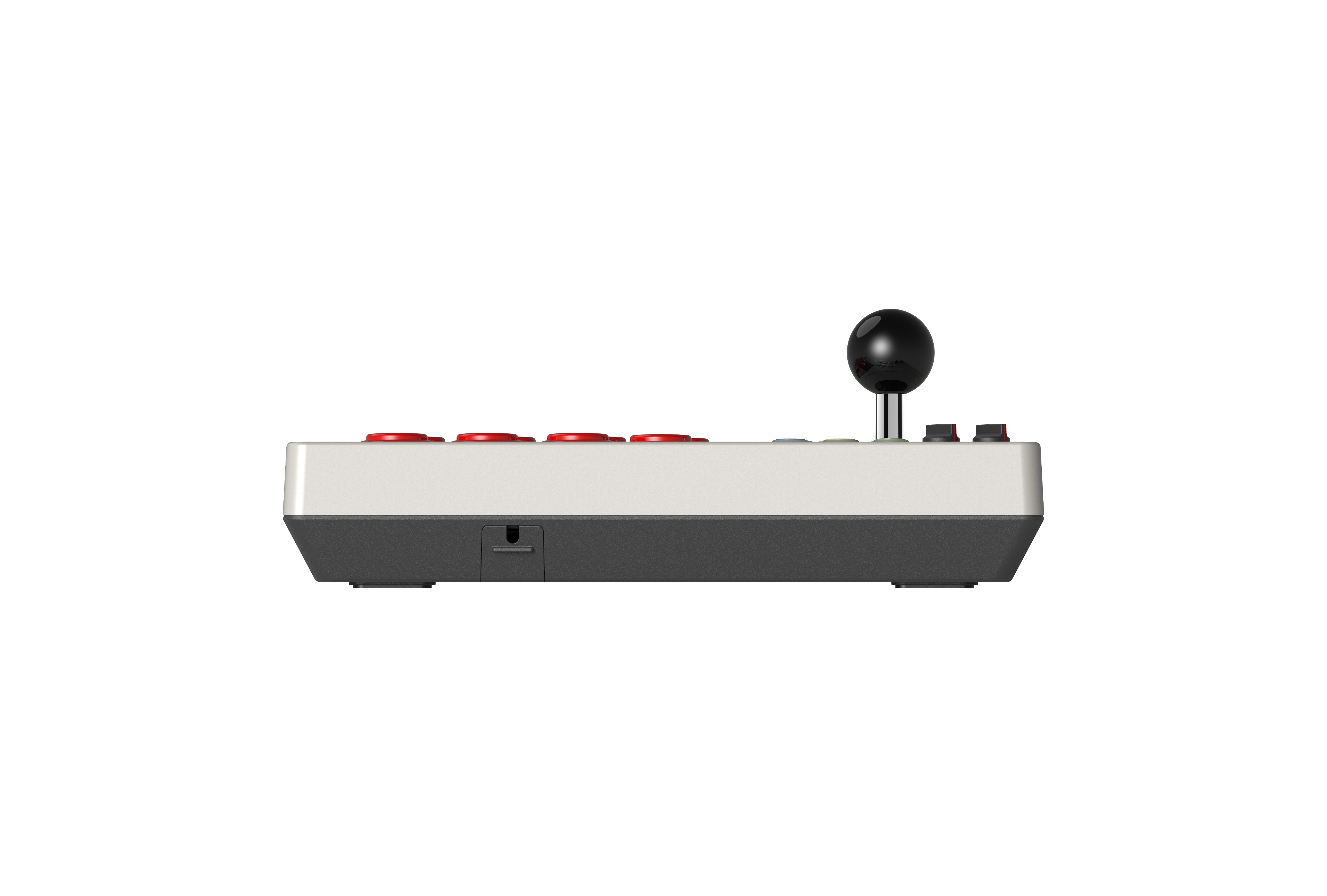Beyaz üst kısma, koyu alt tabana, kırmızı düğmelere ve siyah topuzlu kola sahip bir arcade joystick'in yandan görünümü.