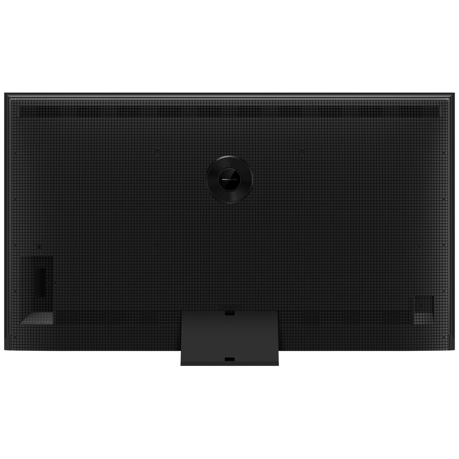 Back of a black television with grid pattern and central round speaker.