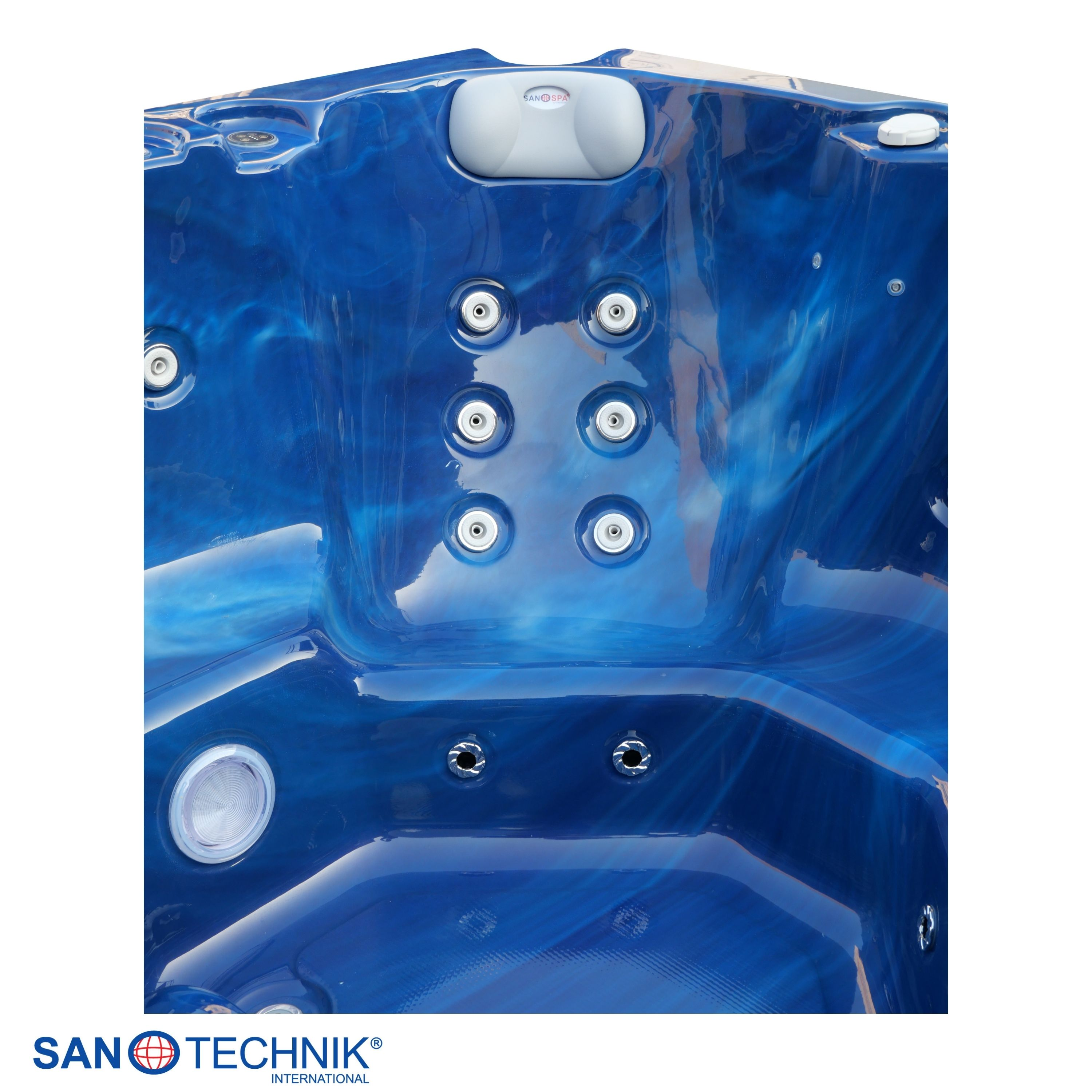 Glänzender blauer Whirlpool mit integrierten weißen Düsen und einer grauen Kopfstütze.