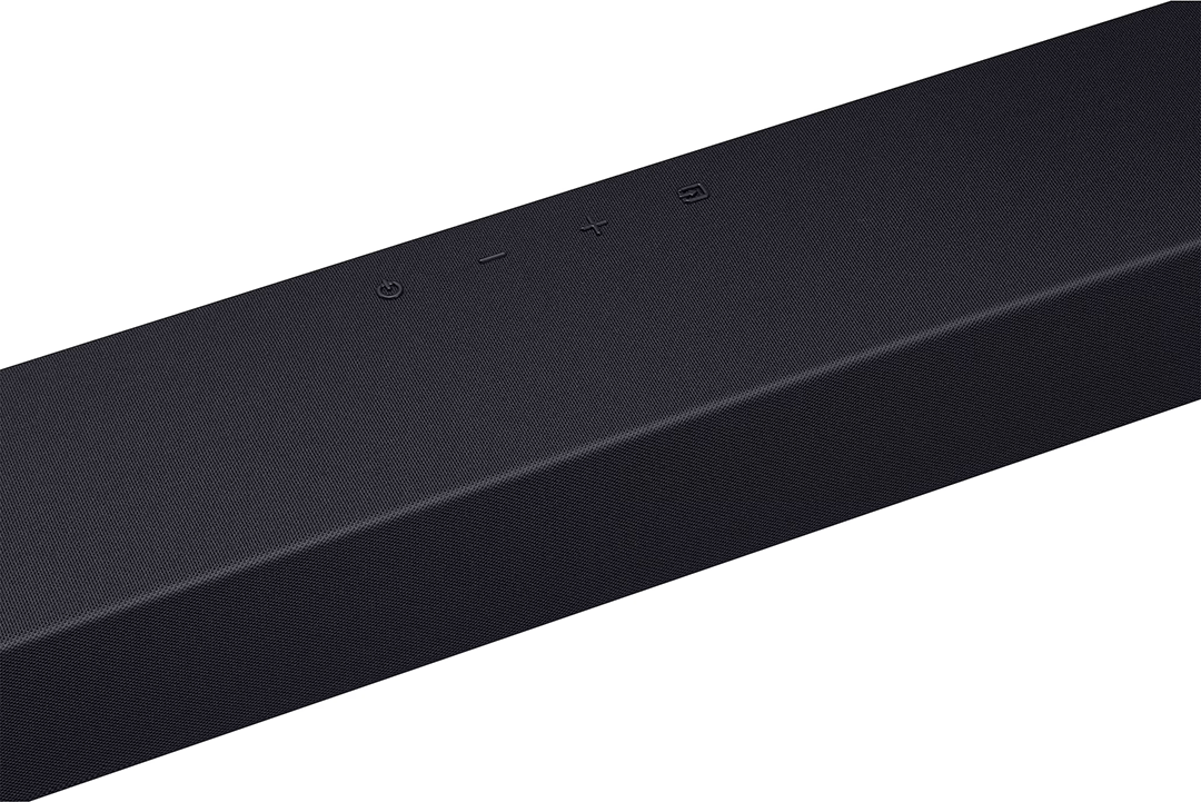 Fekete soundbar közelképe, felül bekapcsoló, hangerő és bemeneti érintőgombokkal.