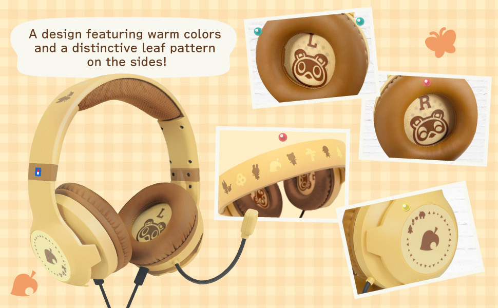 Cuffie da gaming gialle con motivi di Tom Nook e foglie su sfondo a quadri marrone.