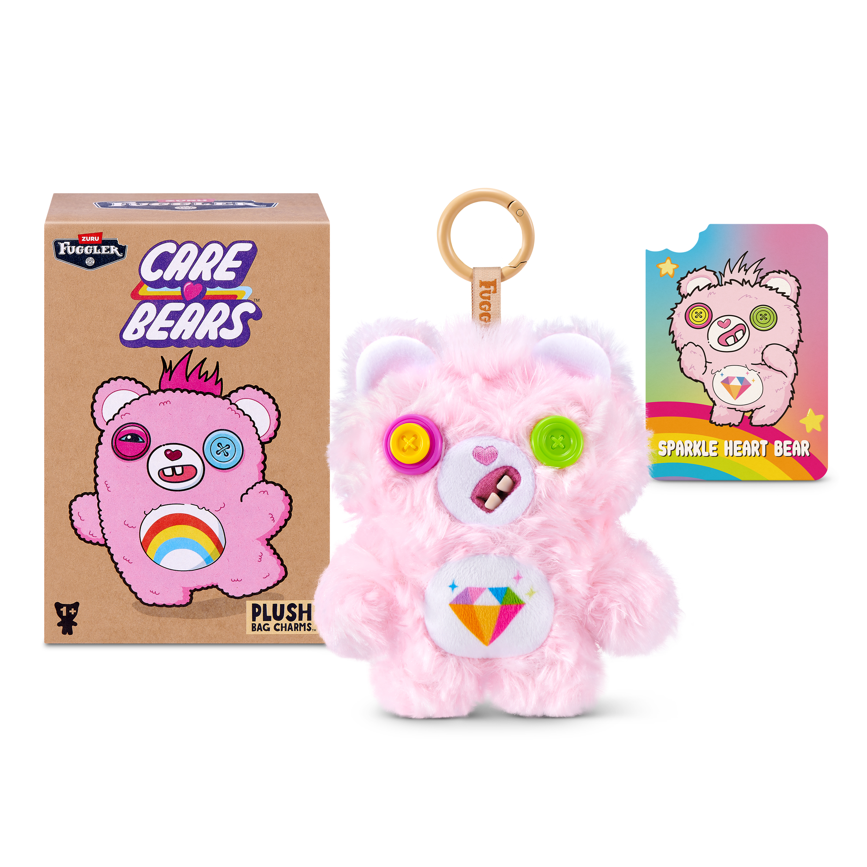 Un llavero de peluche Fuggler Care Bears rosa con caja y tarjeta.