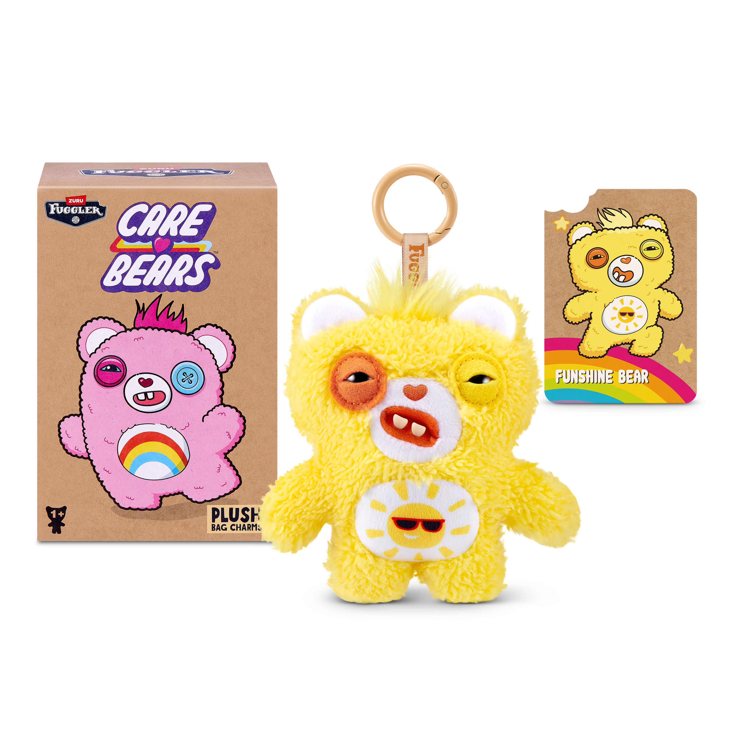 Un colgante de peluche Fuggler Care Bears amarillo con caja y tarjeta de personaje.
