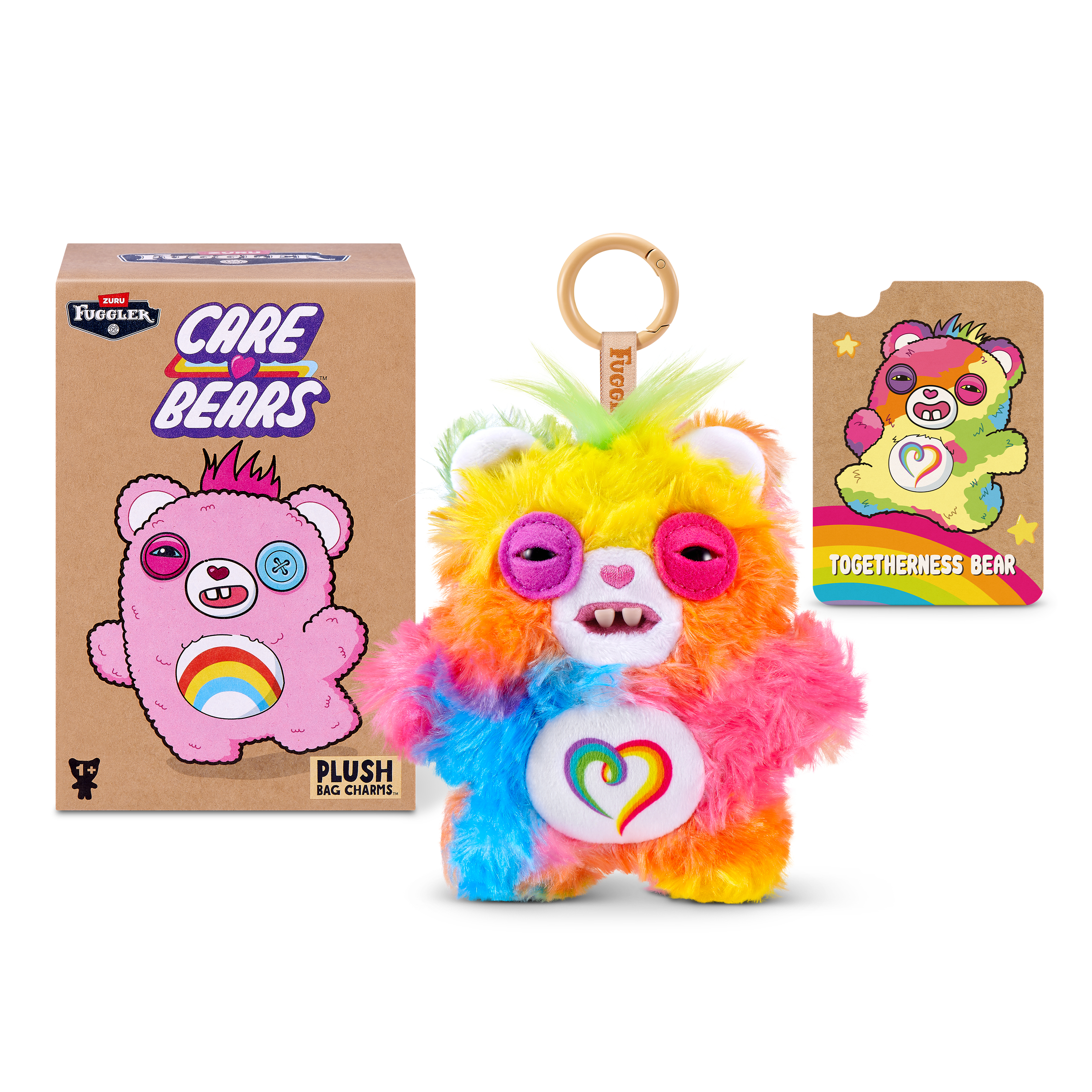 Colorido llavero de peluche Fuggler Care Bears junto a su caja y una tarjeta coleccionable sobre fondo blanco.