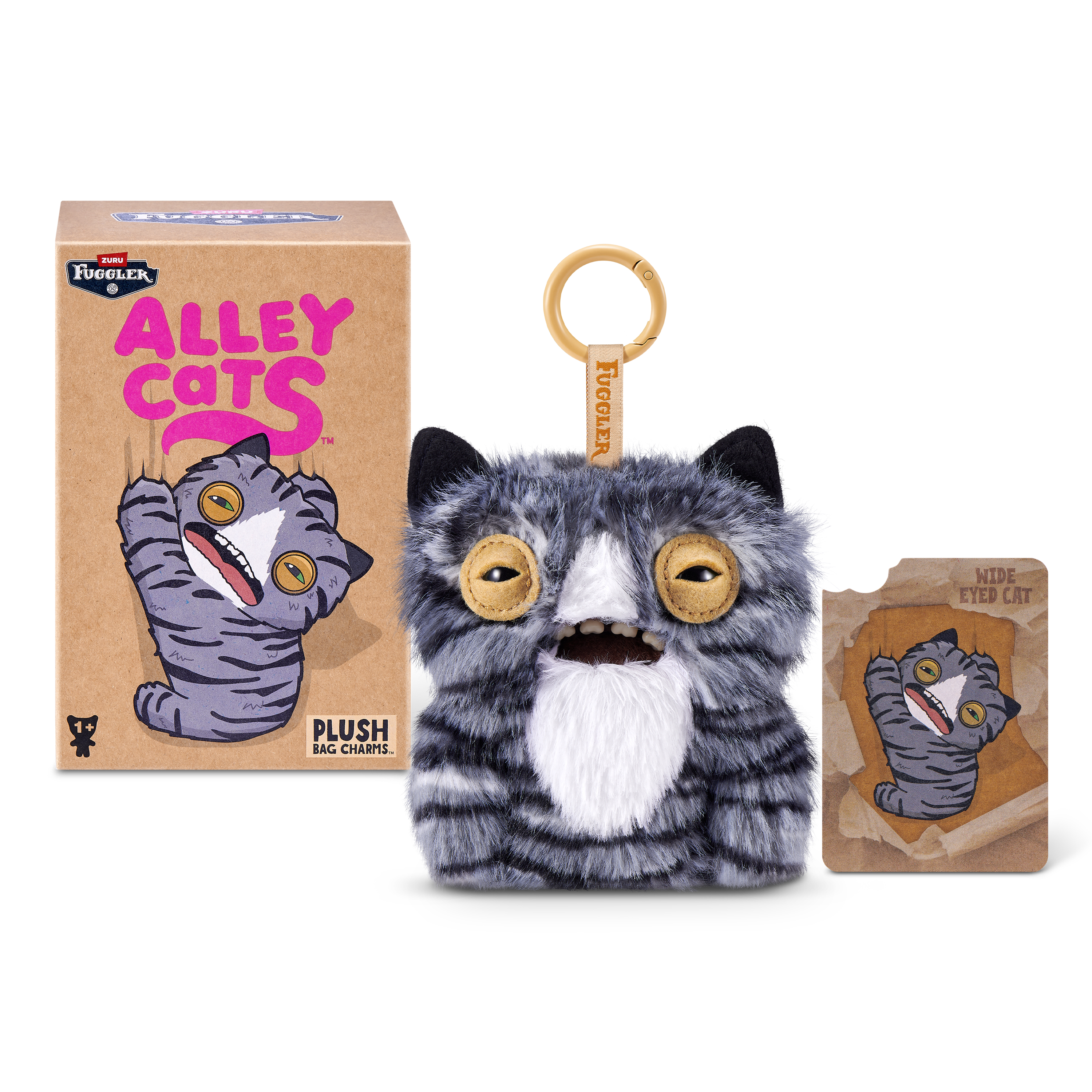 Un llavero de peluche de gato Fuggler gris y blanco con grandes ojos de botón, junto a su caja y tarjeta.