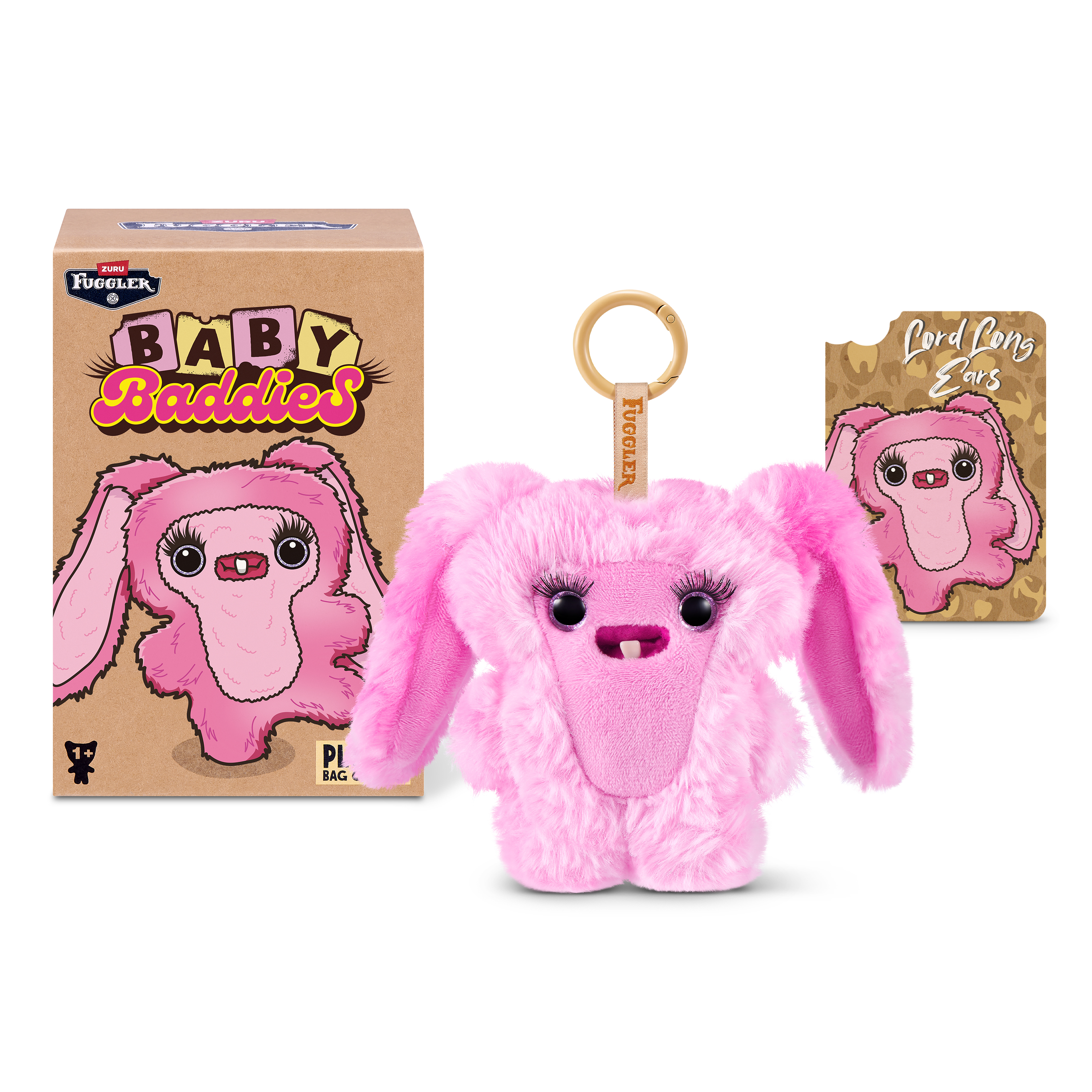 Un llavero peludo rosa de Fuggler Baby Baddies con su caja y tarjeta sobre fondo blanco.