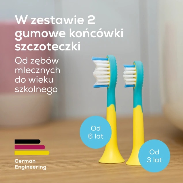 Dwie kolorowe końcówki szczoteczki elektrycznej z białymi i niebieskimi włoskami na drewnianym stole.