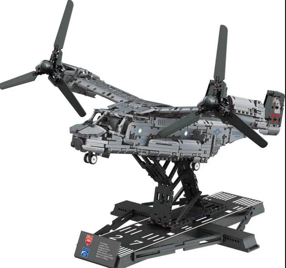 Ein graues Lego-Technic-Modell eines V-22 Osprey Flugzeugs auf einem Ständer vor weißem Hintergrund.