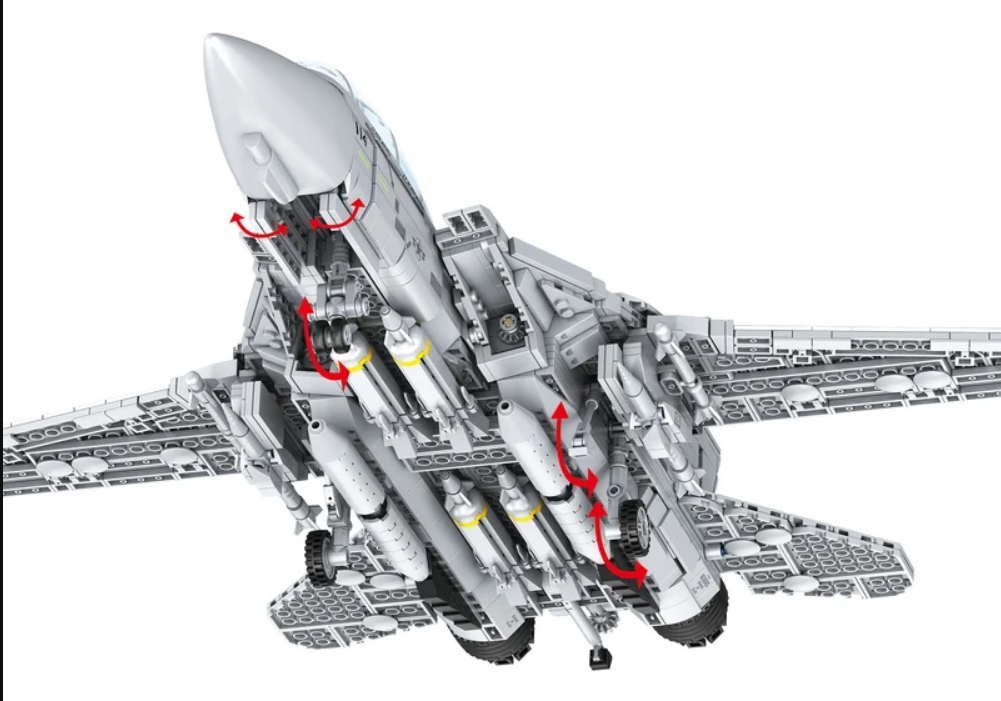Unterseite eines grauen Spielzeug-Kampfjets mit roten Bewegungspfeilen für Fahrwerk und Klappen.