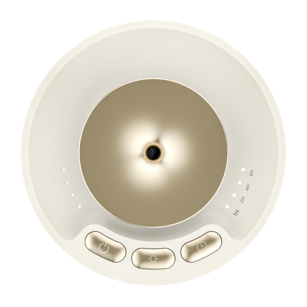 Vista superior de un humidificador blanco crema con tapa de cúpula dorada y tres botones.