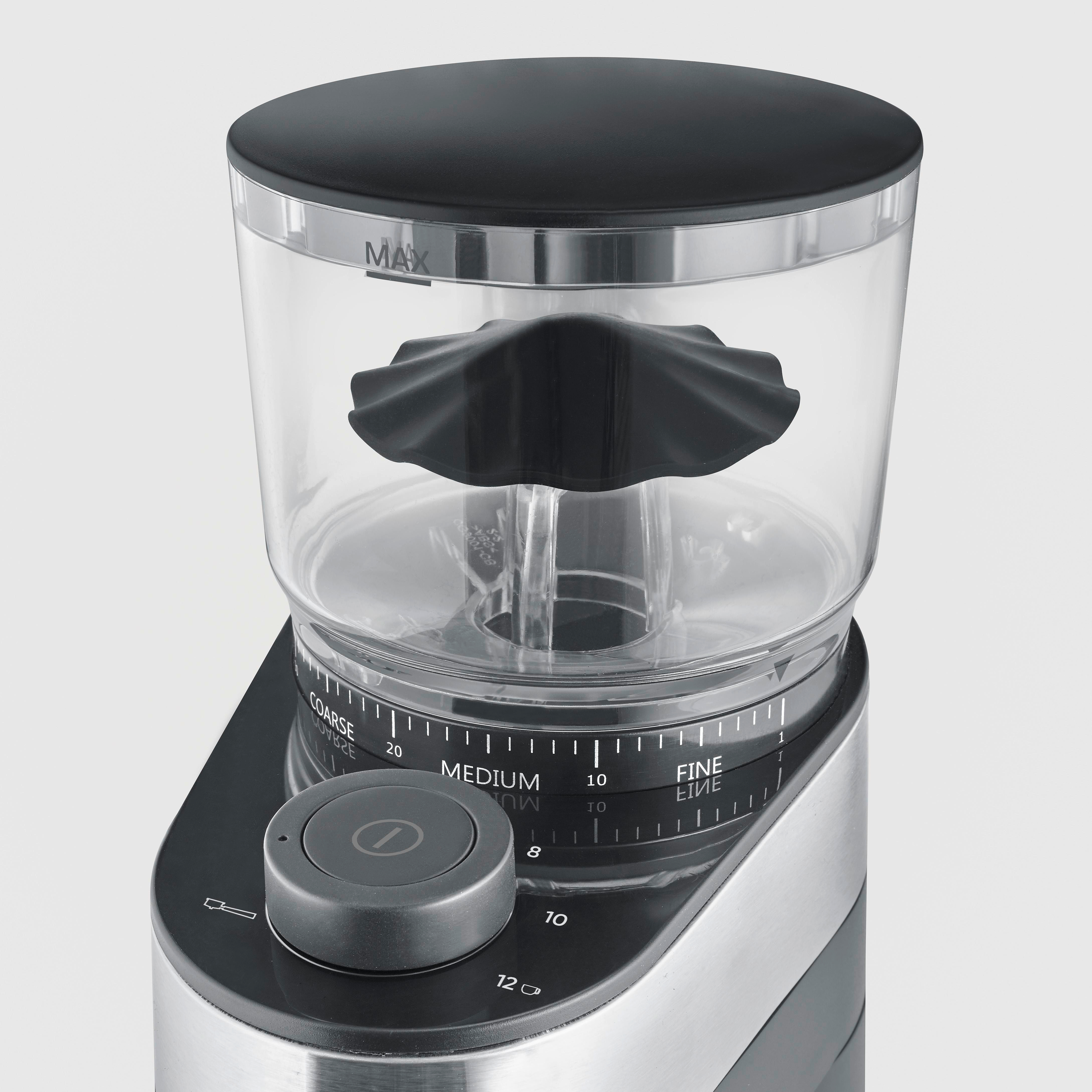Nahaufnahme einer elektrischen Kaffeemühle mit einem klaren Bohnenbehälter, Einstellskala und Ein/Aus-Schalter.