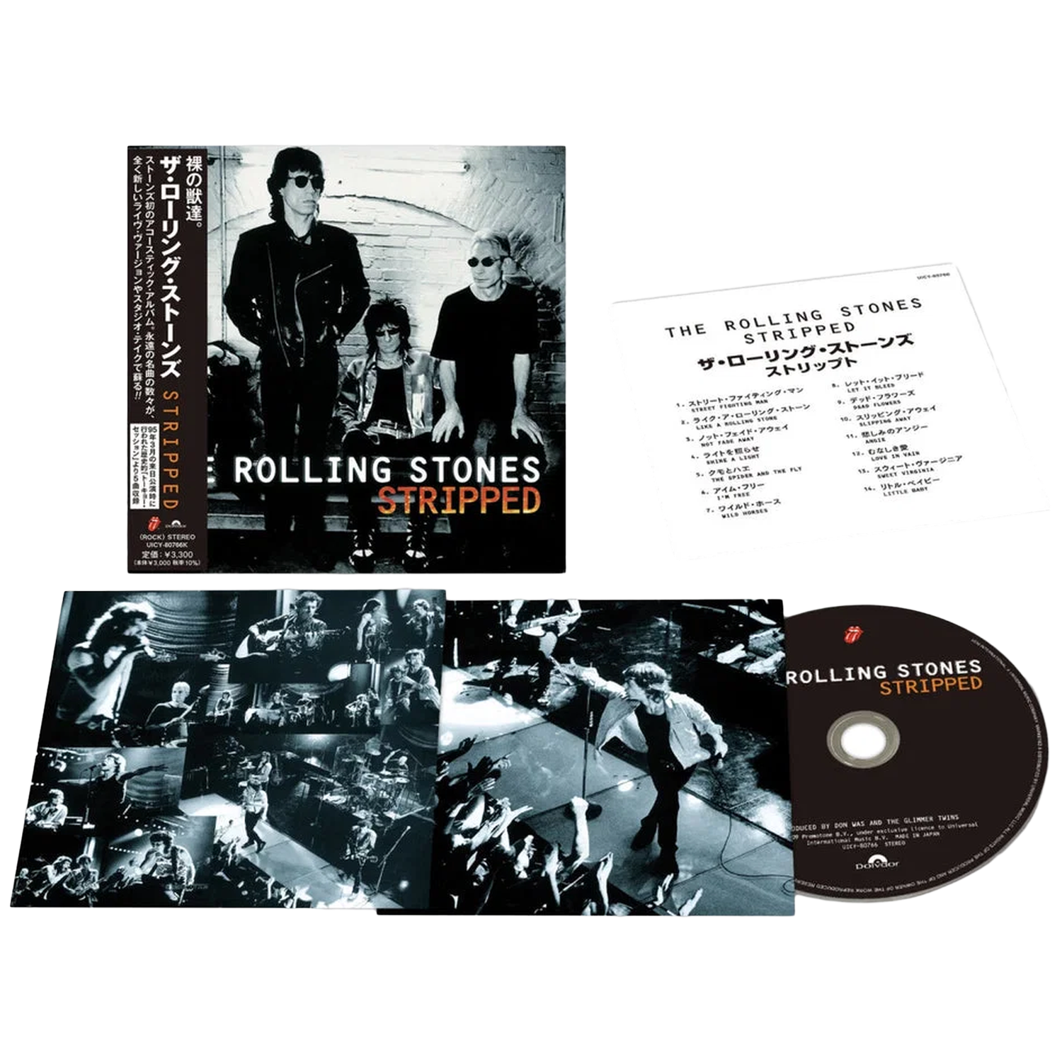 De Rolling Stones Stripped cd-set met hoes, boekje en disc op zwarte achtergrond.