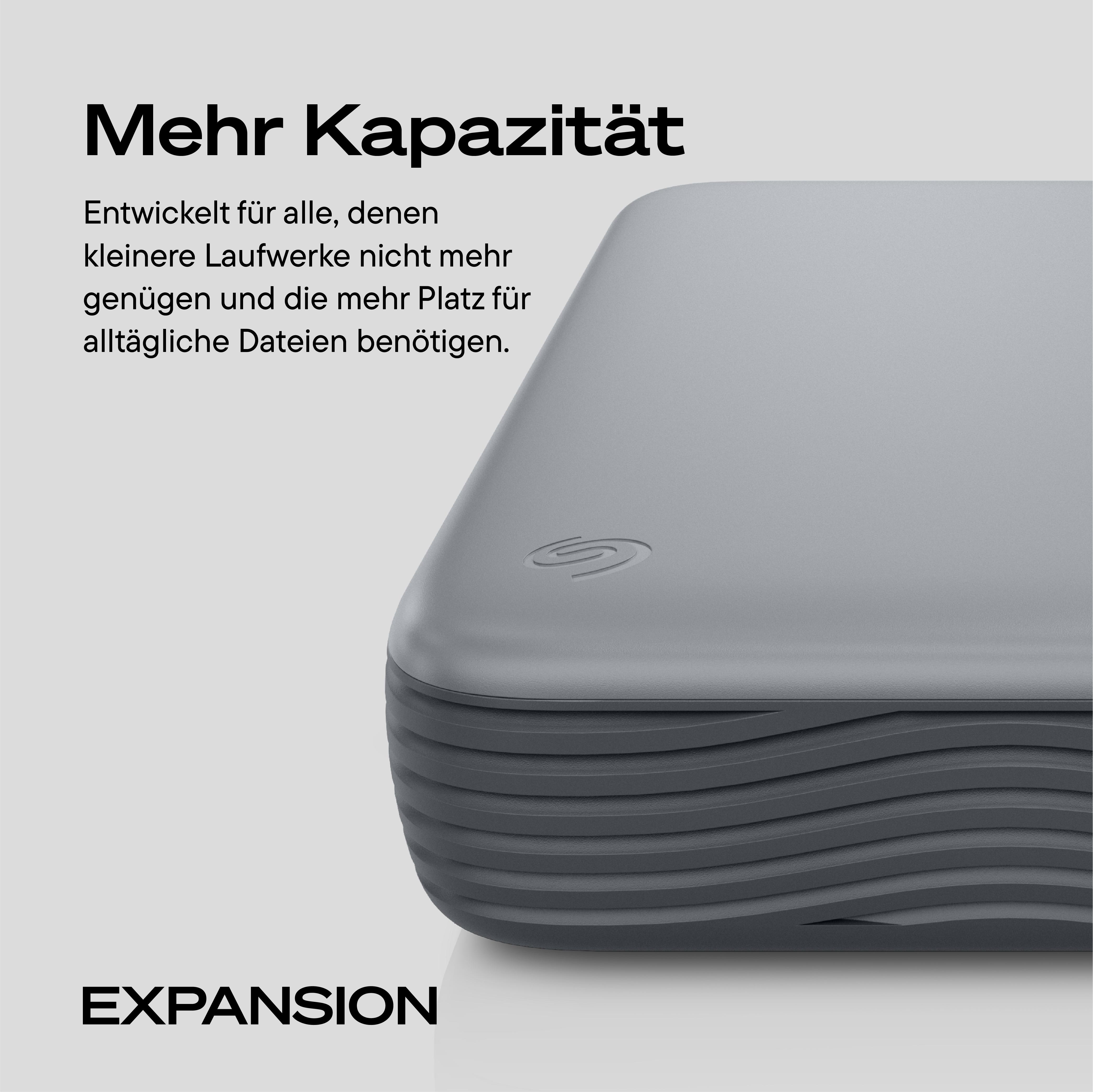 Graue Seagate Expansion Festplatte mit deutscher Werbung für mehr Speicherkapazität.