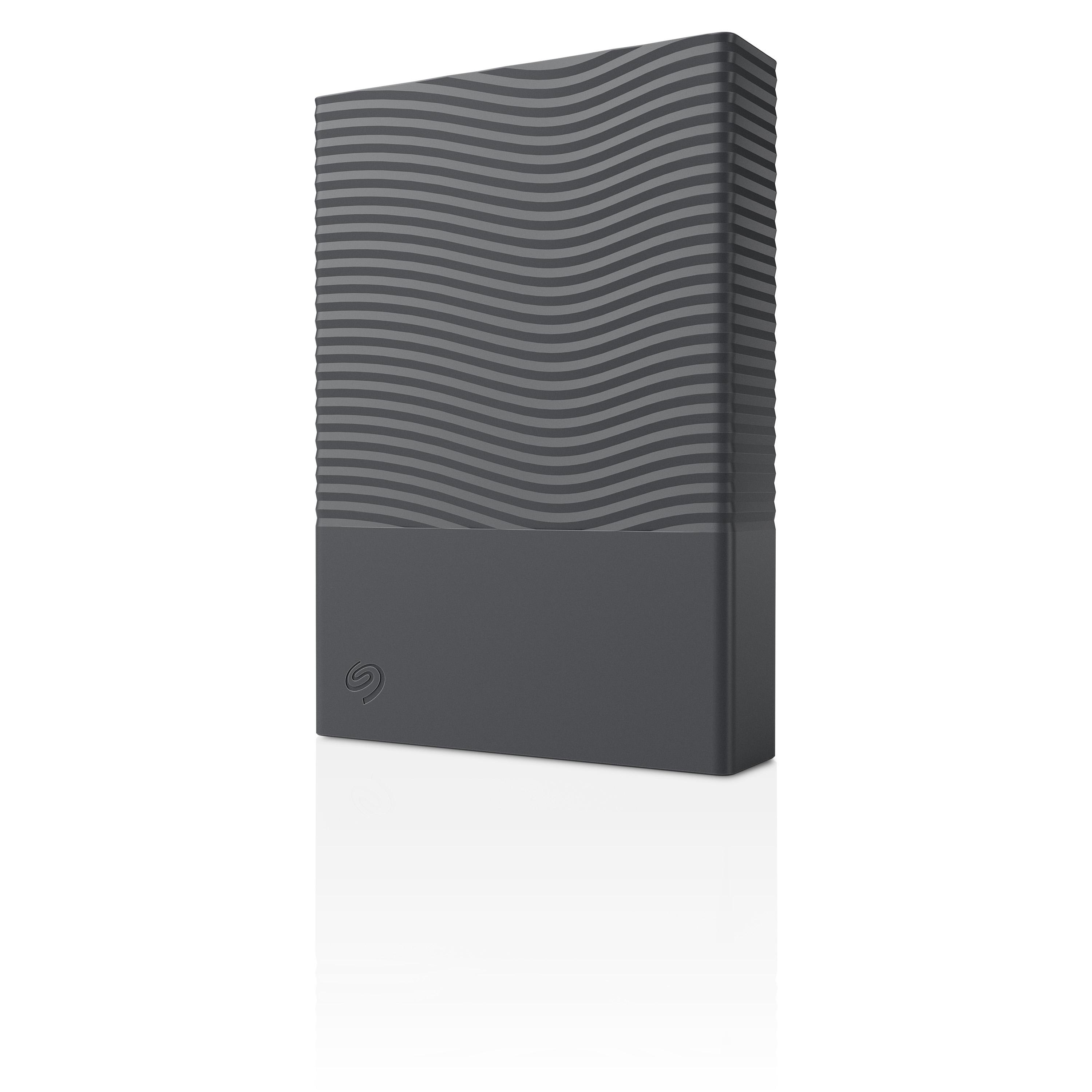 Graue externe Festplatte mit wellenförmigem Muster und Seagate-Logo auf weißem Hintergrund.